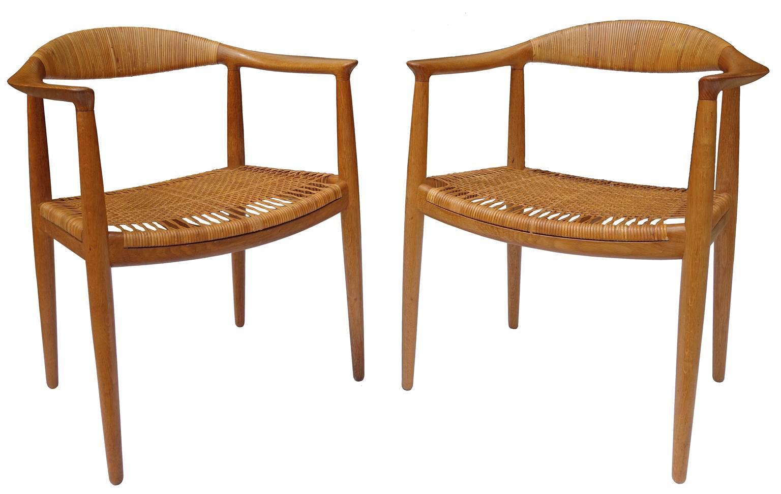 Model JH501, Denmark, 1960s; teak, woven reed; branded with designer and manufacturer name (Johannes Hansen). All cane is in excellent condition. Also known as "The Chair"

Price is per chair