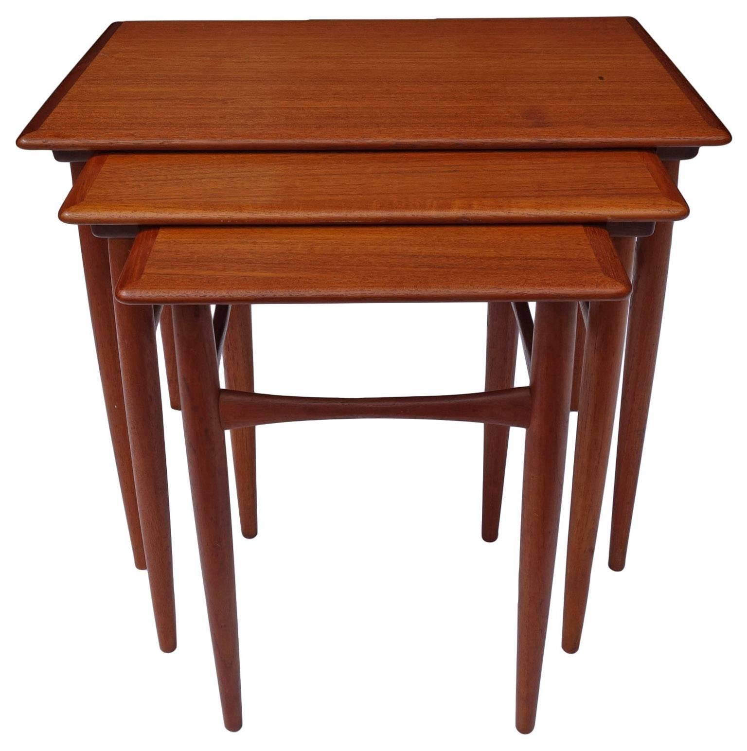 Handsome set of teak Mid-Century nesting or stacking tables.