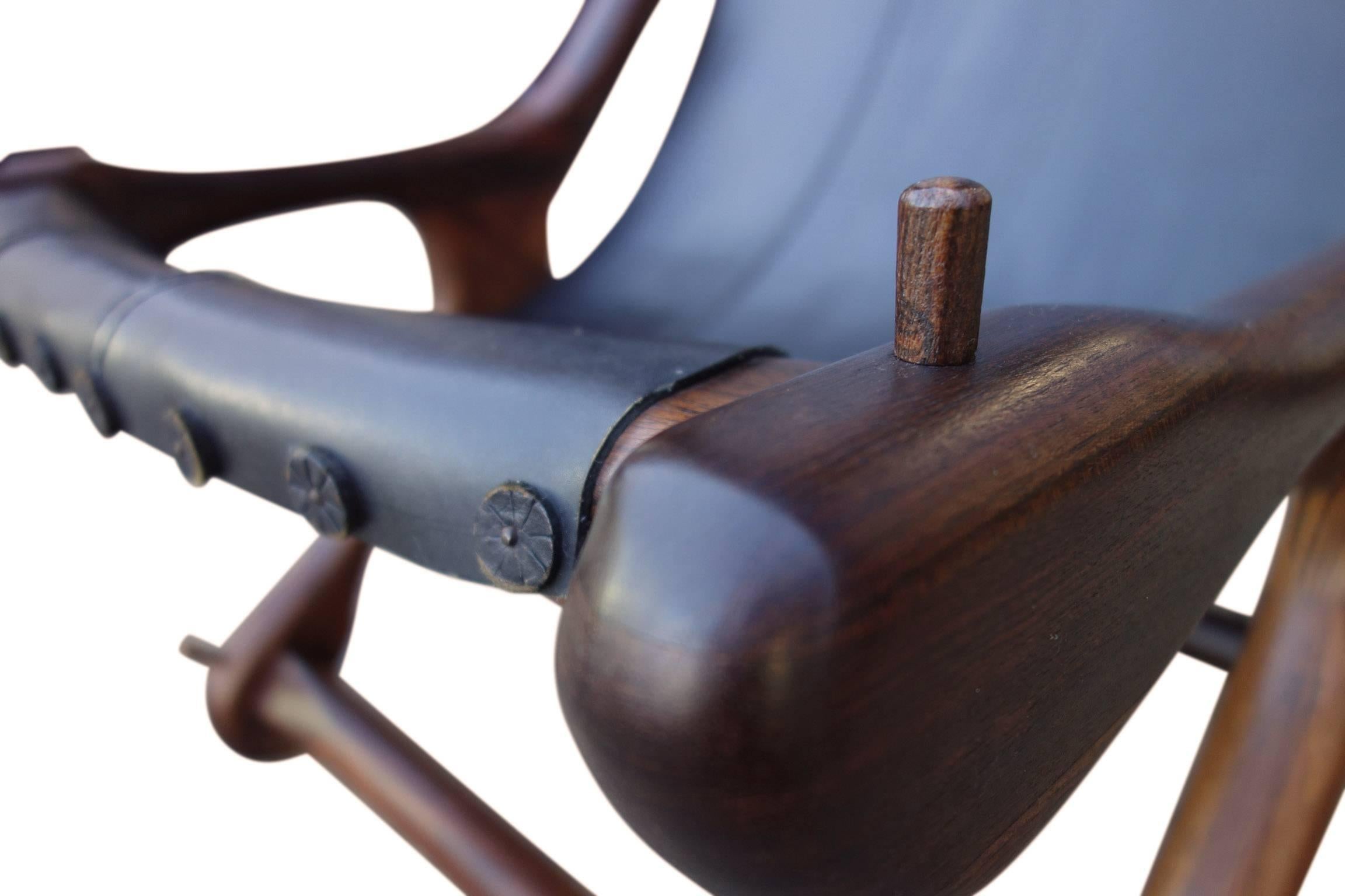 Wonderfully crafted lounge chair in rosewood / Cocobolo (one of the finest woods in the world). All original and beautifully kept condition. The black leather is soft and supple. Don S. Shoemaker is the most important and praised Mid-Century Modern