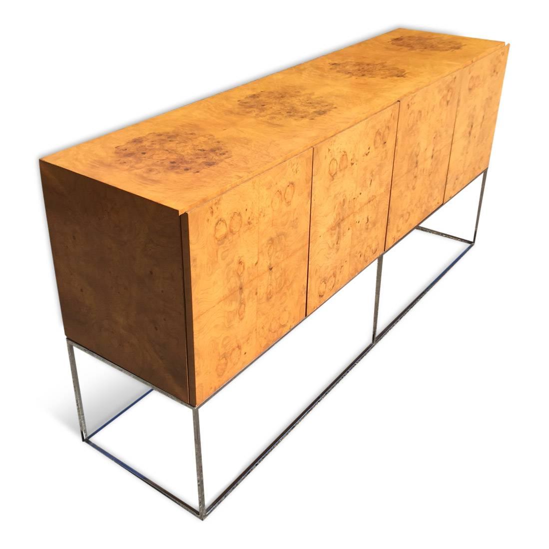 For your consideration is a beautiful Milo Baughman for Thayer Coggin sideboard or credenza in book matched olive burl wood veneer on a slim chrome base. 

The piece is a beautiful Mid-Century Modern 1970s statement piece from one of the masters