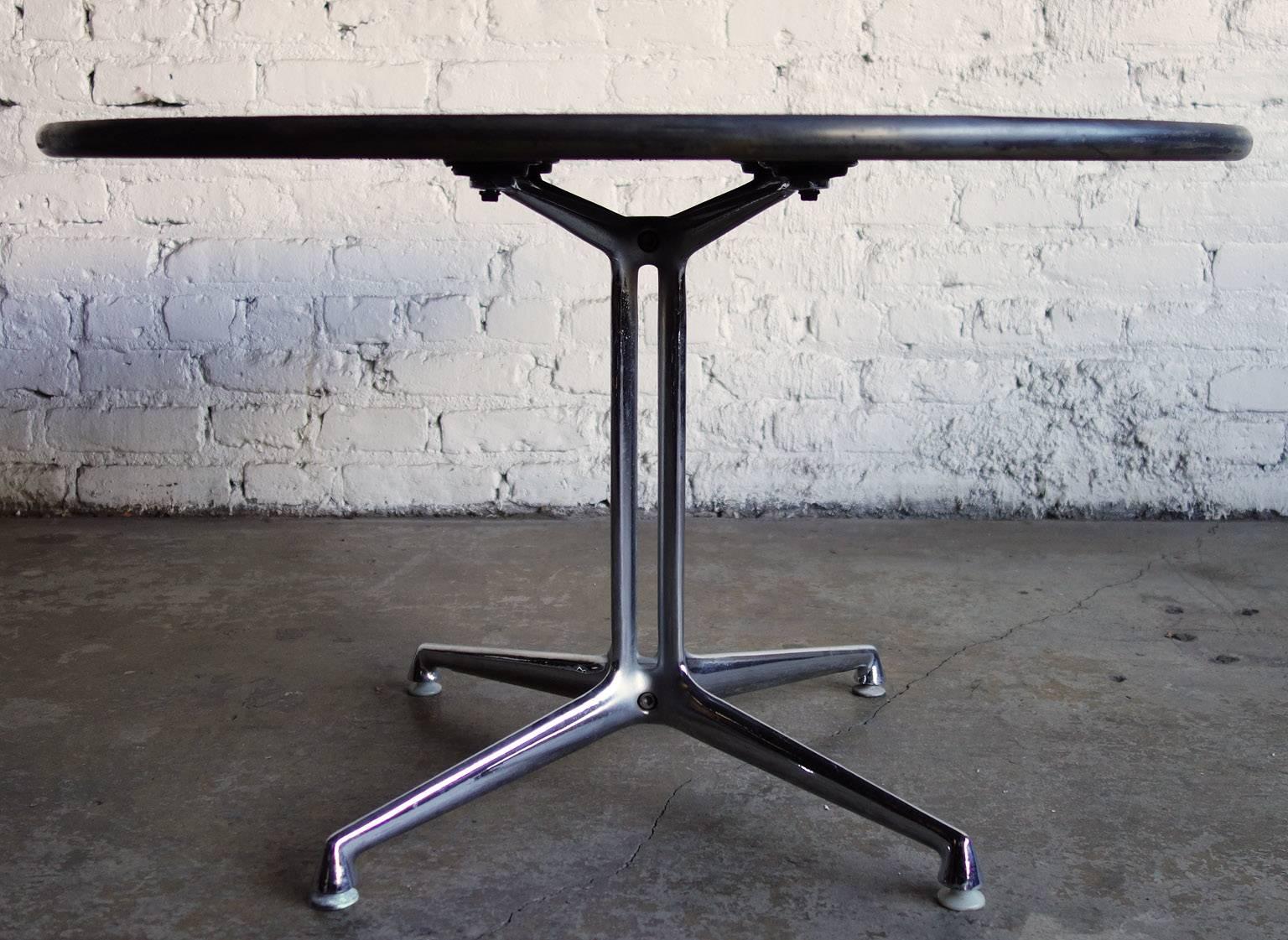Designed by Alexander Girard and Charles and Ray Eames for the La Fonda Del Sol Restaurant. This table was available through Herman Miller for a short time. This example has a natural late top. A Mid-Century masterpiece.