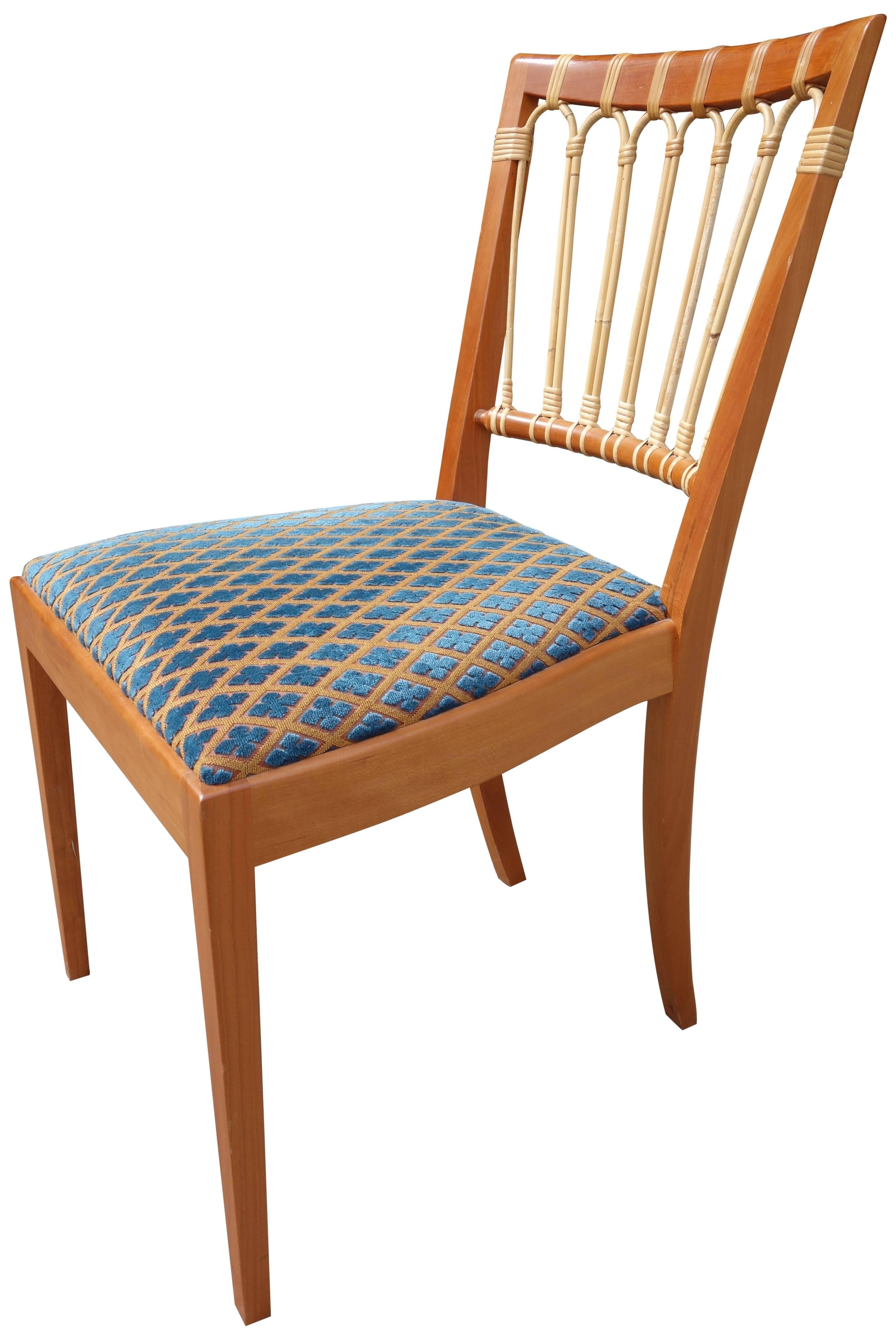 Exceptional model #1165 dining chairs have an openwork back of rattan on wood frame. Designed in 1947.
Original fabric and chairs are in very good condition.