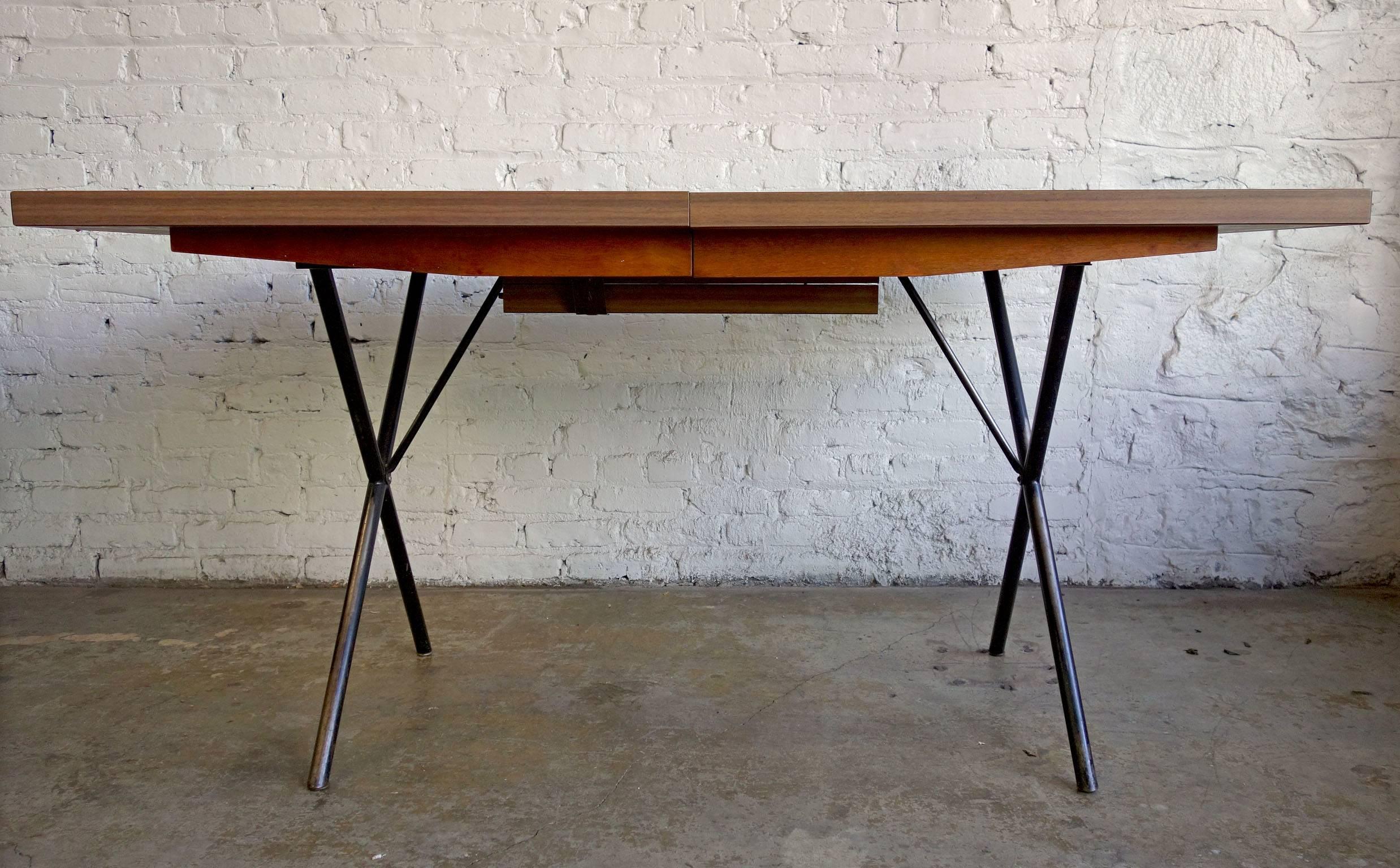 Early Mid-Century George Nelson for Herman Miller X-leg dining table.
Perfect patina on this dining or kitchen table that can be extended from 54