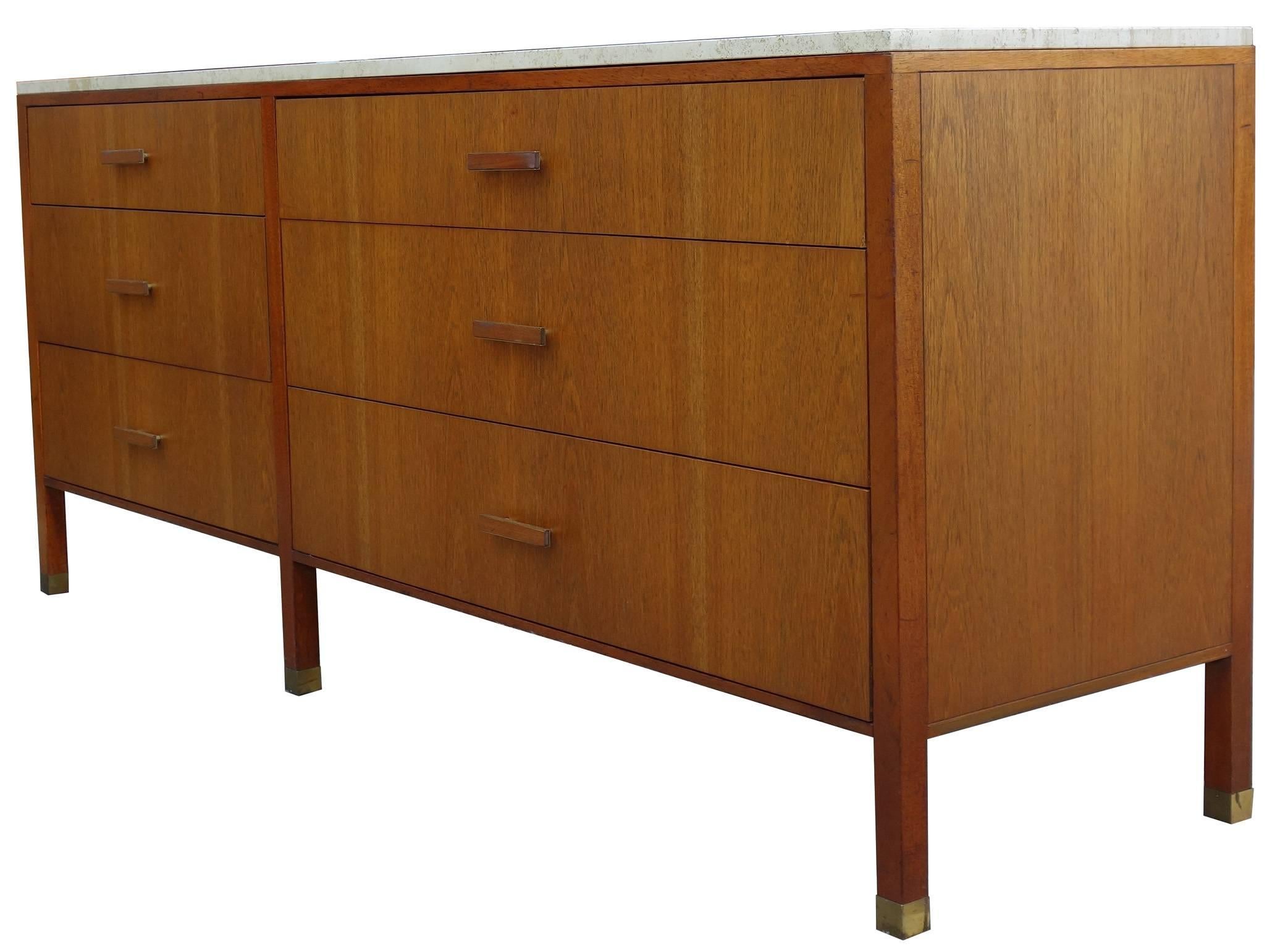 Important Mid-Century Harvey Probber dresser with travertine top and brass details. This piece has a wonderful presence and is finely crafted. 

Just under 6.5' in length.
Original travertine top hand signed by workshop on the underside.
Retains