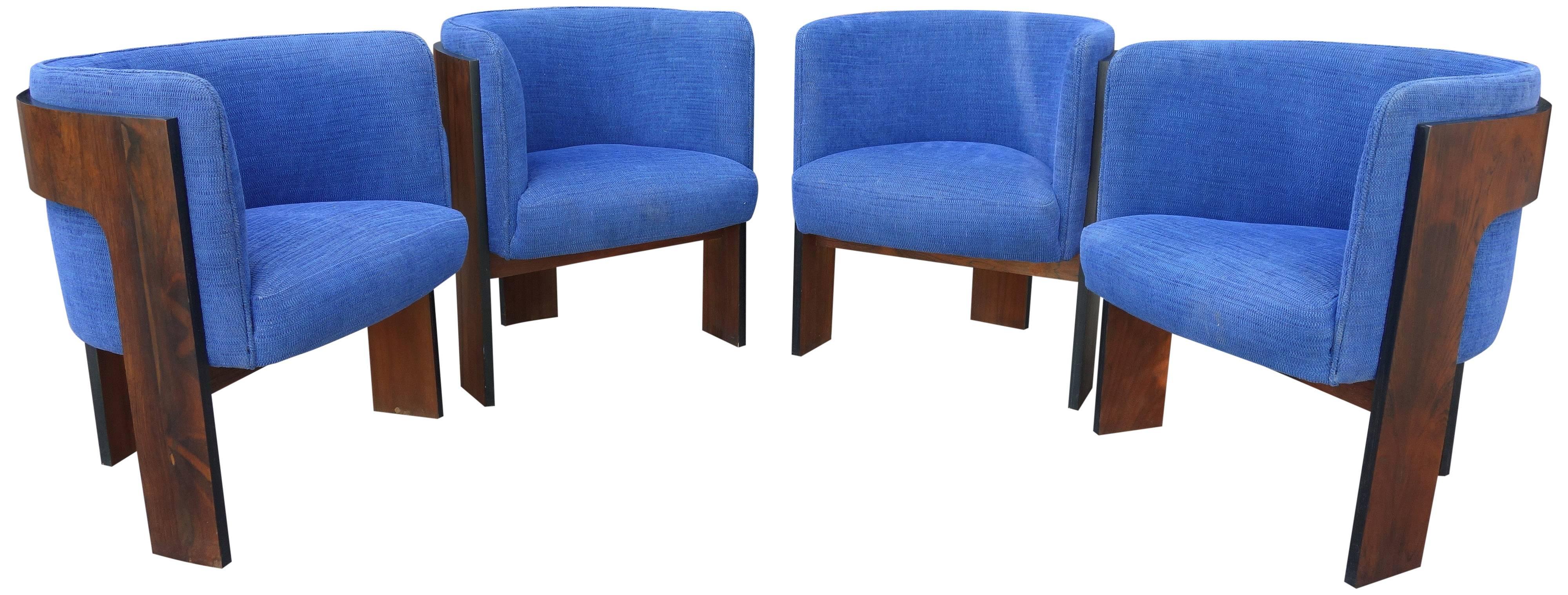 Set of four Mid-Century Milo Baughman rosewood T-form dining chairs. Rarely seen design. Used alone they would make great side, easy, or reading chairs. 

Rosewood shows no sun fading and original fabric in excellent condition. Overall showing