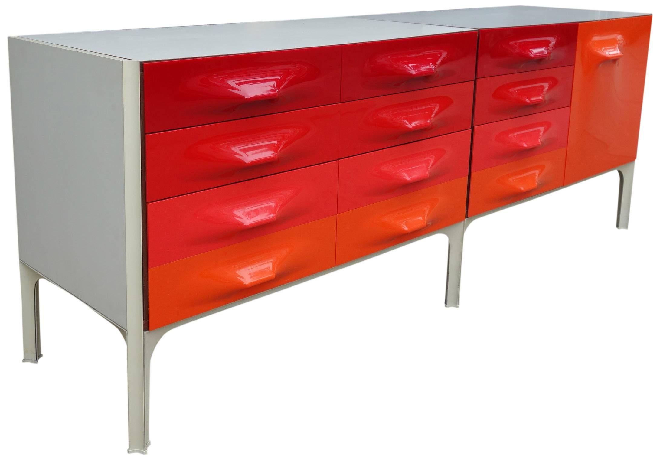 Mid-Century Raymond Loewy DF-2000 credenza for Doubinsky Frères, France. Hard to find red front panels. All glides present and front panels showing minimal wear. Excellent example. Two case pieces easily bolt together and separate for shipping. (as