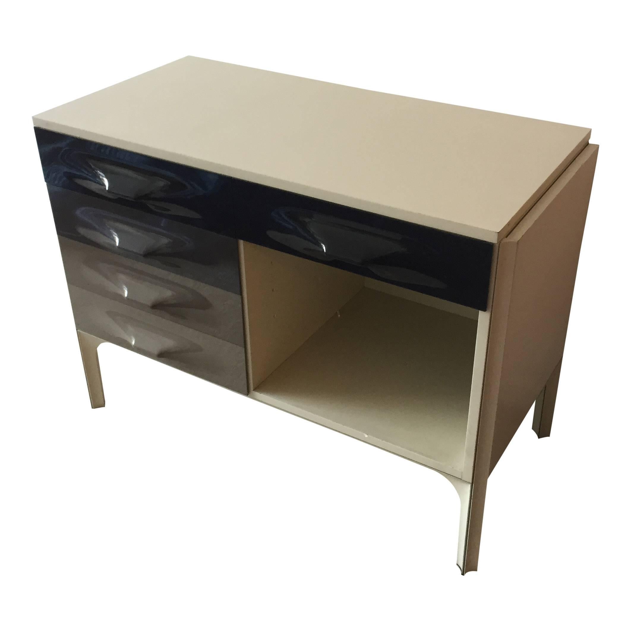 For your consideration is a striking piece of Industrial Design by one of the 20th century's leading designers the DF2000 sliding-top desk by Raymond Loewy.

This hard-to-find piece was manufactured in France. Its unusual form is characteristic of