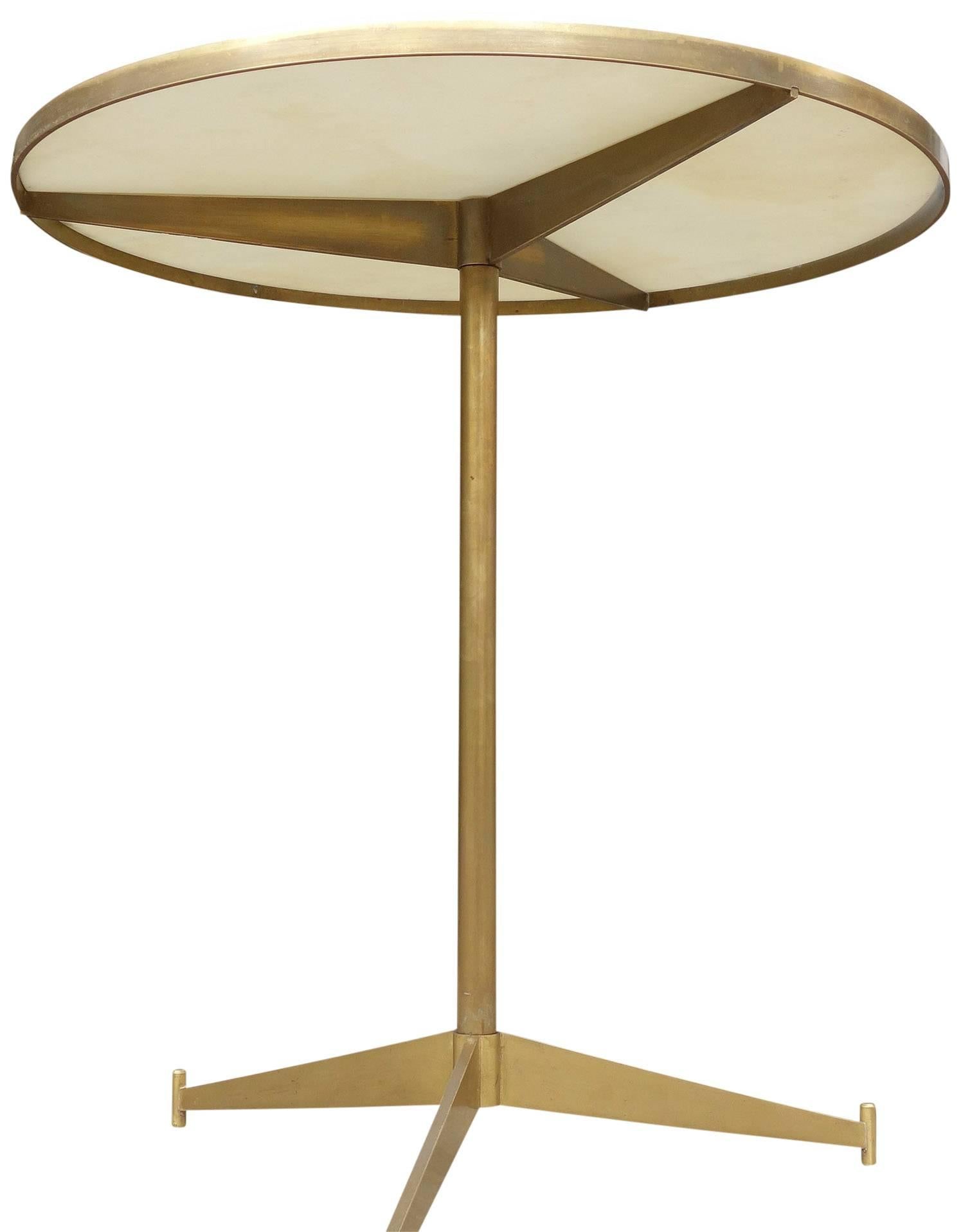 Exceptional Paul McCobb side table for Directional. (Also known as the cigarette table) This is perhaps his rarest design. Simple and elegant lines with a solid brass frame on an opaque white glass top. 
Model 1094. 1956.
 