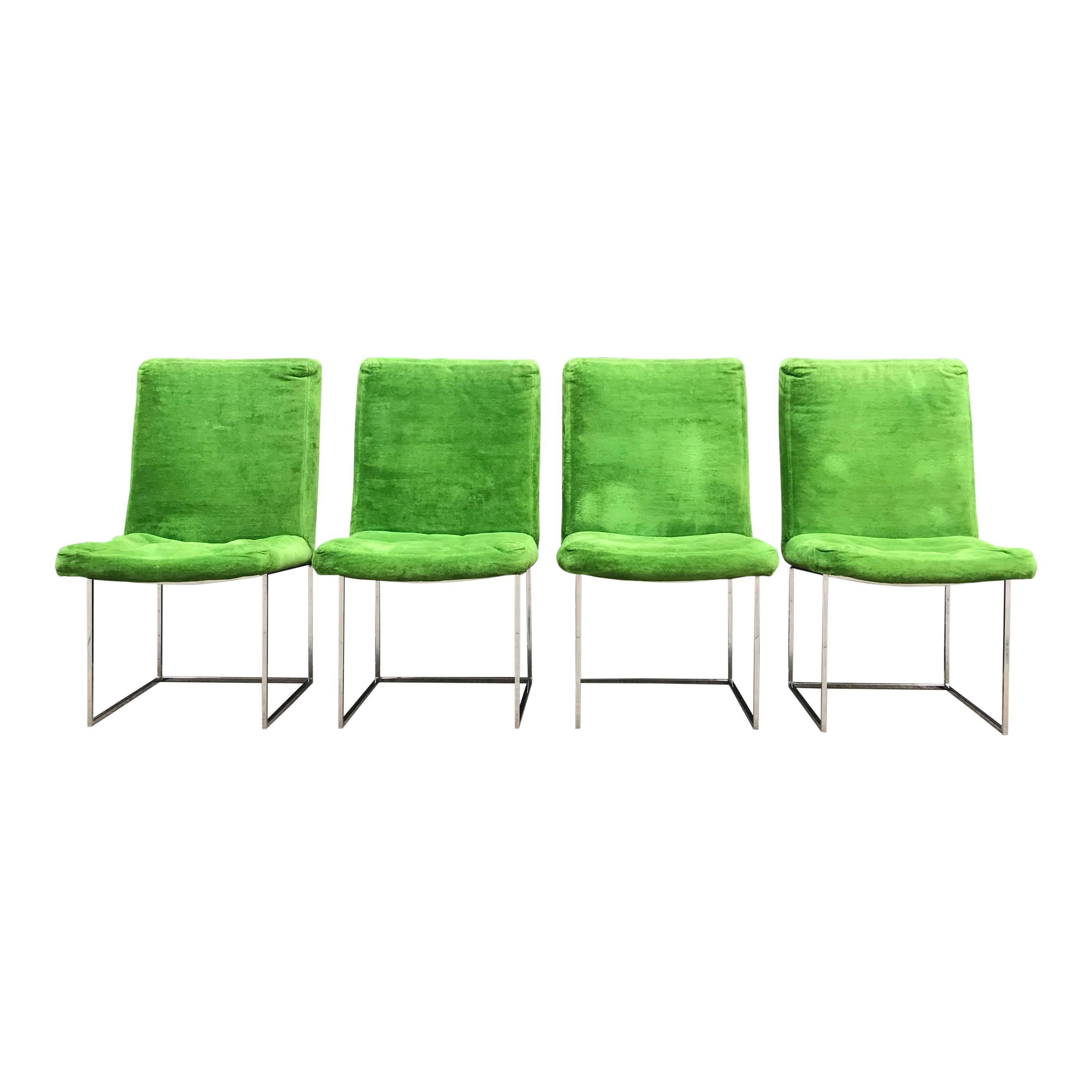 For your consideration are a fantastic set of four Milo Baughman for Thayer Coggin dining chairs. The chairs, set on an angular thin chrome base, appear to float as they lie suspended above the frames. The chrome is in excellent shape. The original