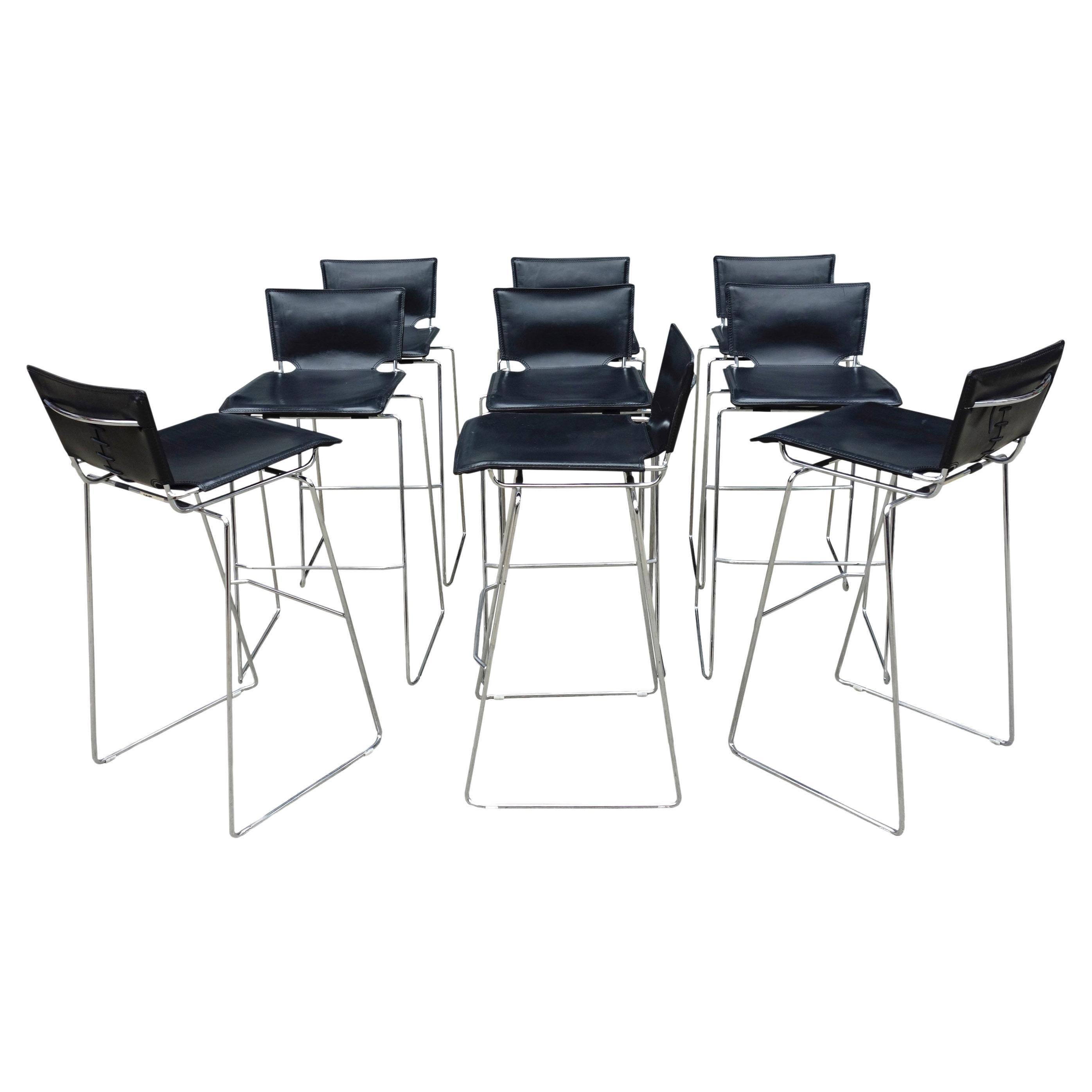 Beautiful and sleek set of 9 stackable stools designed by Toyoda Hiroyuki for ICF. Thick black leather covering a heavily chromed base. Wonderful details of stitched and laced leather. These can easily be stacked in groups of 5 as space saving