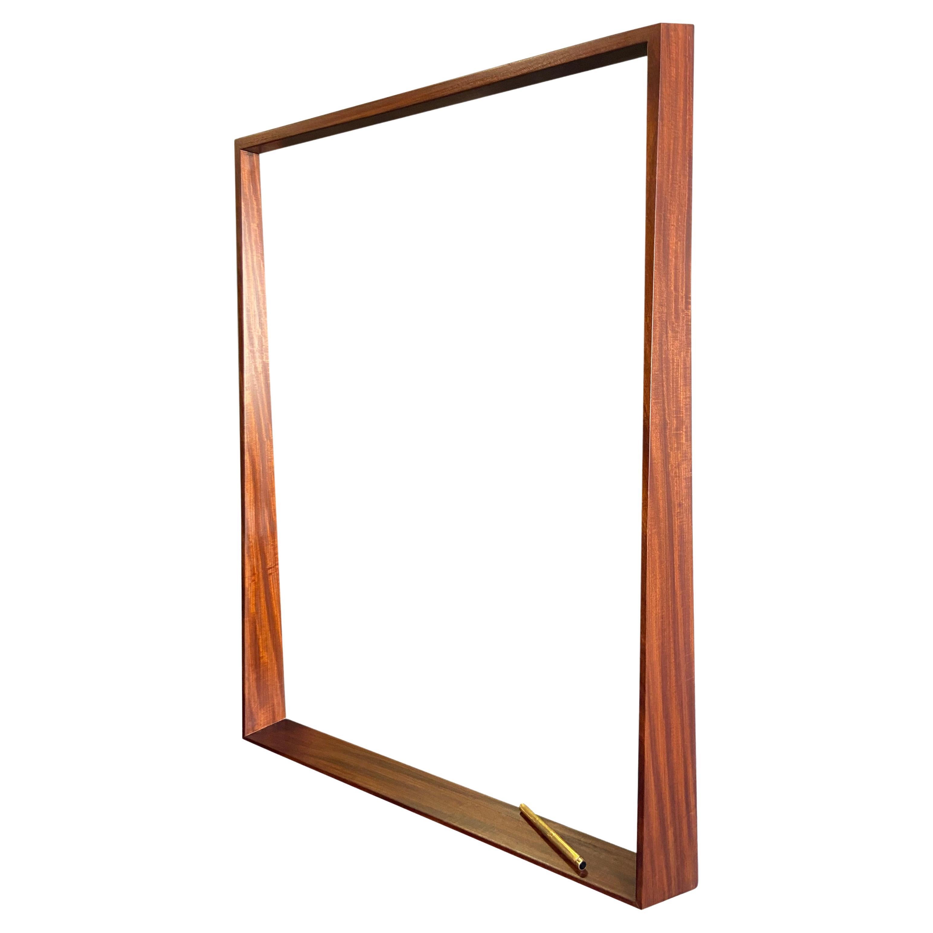 For your consideration is this wonderful black walnut mirror with wonderful grain. Very Intricately designed with tight joinery featuring a bottom ledge and trapezoidal frame having both a minimal yet complex look to it. In the style of modern craft