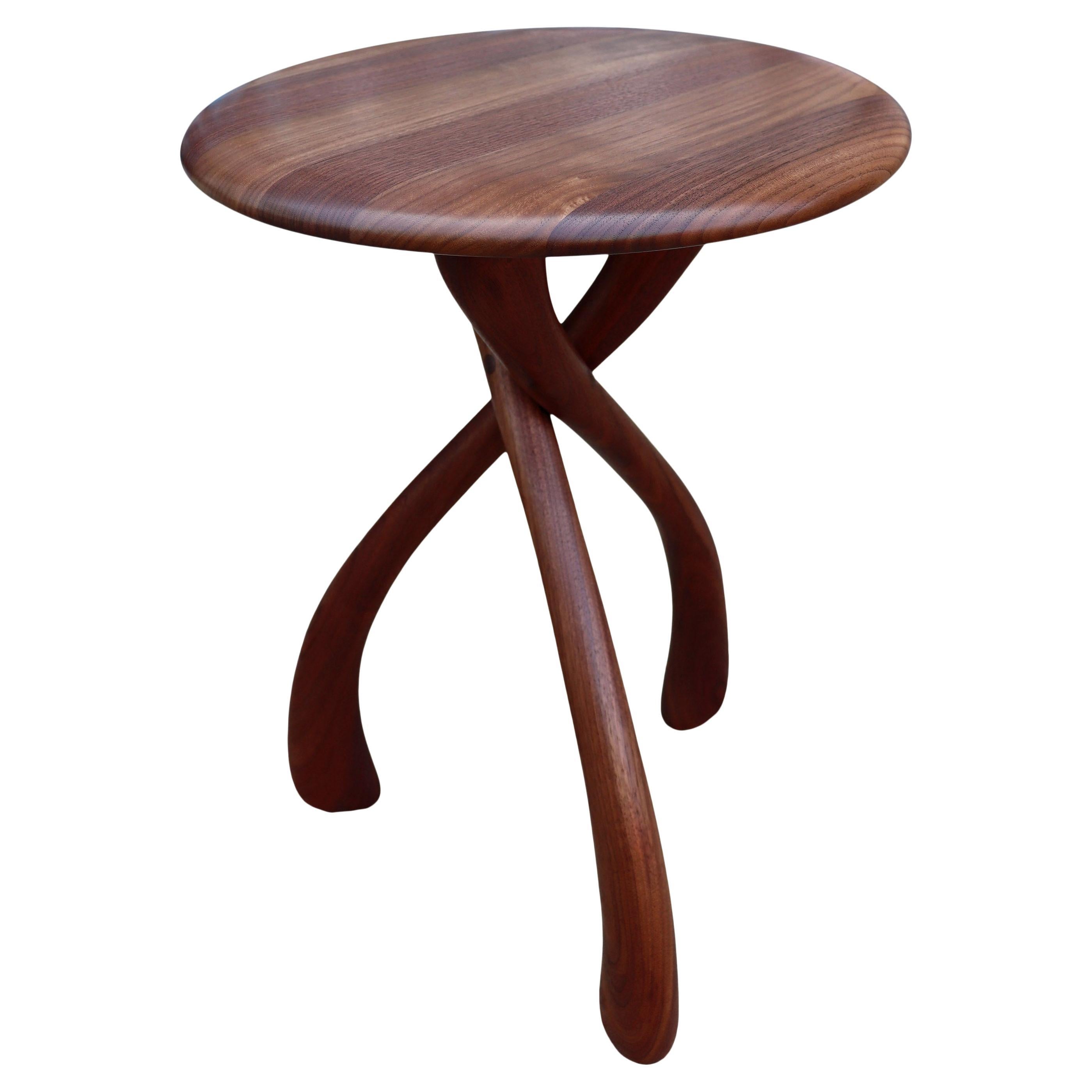 

Beautiful wishbone circular table designed by Dean Santner featuring black walnut construction. This amazing design looks simple yet complex at the same time. Wonderful proportions make great use as a side table, end table, bedside tables or