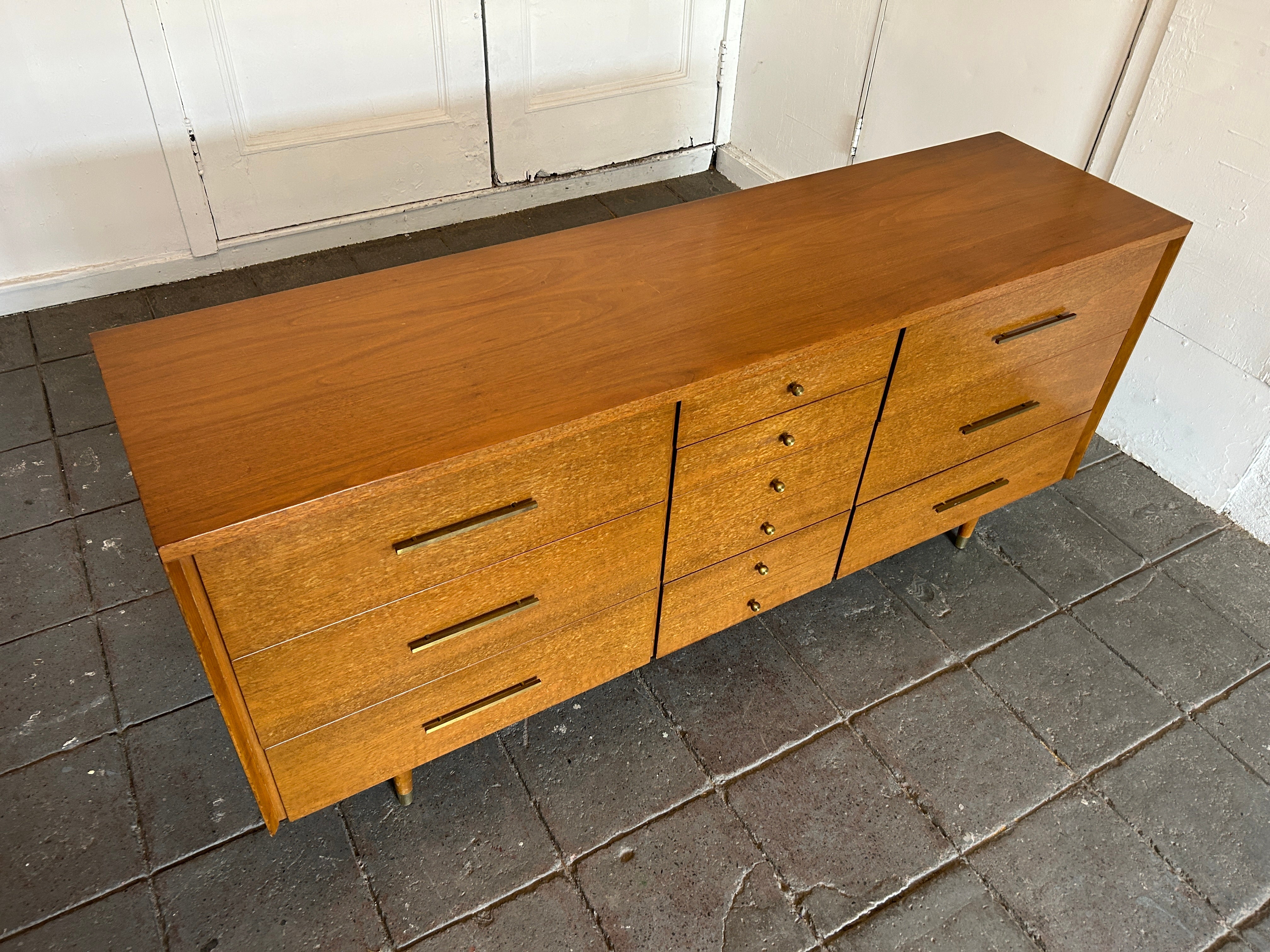 Stunning Mid-Century Modern John Stuart Widdicomb walnut 10 drawer dresser credenza Brass Knobs and Pull Handles. Walnut wood with speckled finish. Very clean Dresser inside and out all drawers are clean and slide smooth. Very high quality
