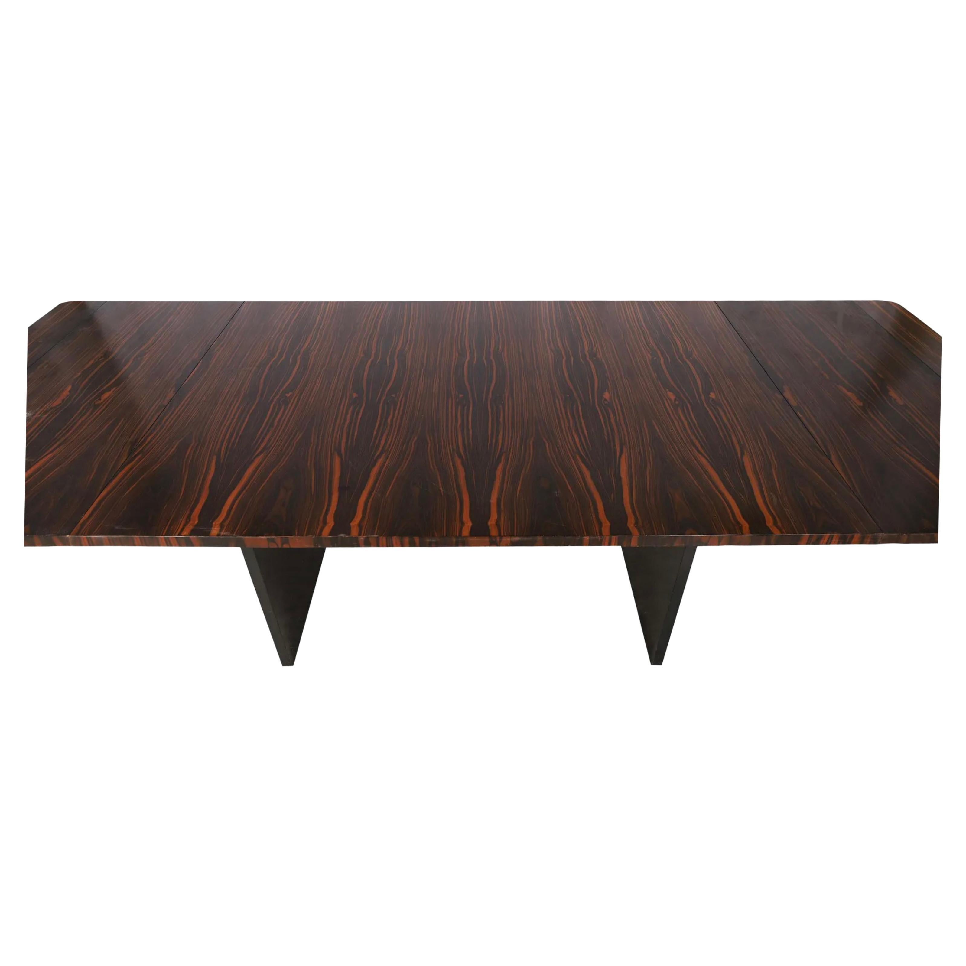 Stunning midcentury Brazilian rosewood Rectangle Modern extension dining table with (2) leaves. This table has Black wood legs with chrome stretcher. This table is in beautiful condition with black, dark brown and reddish rosewood tones very great