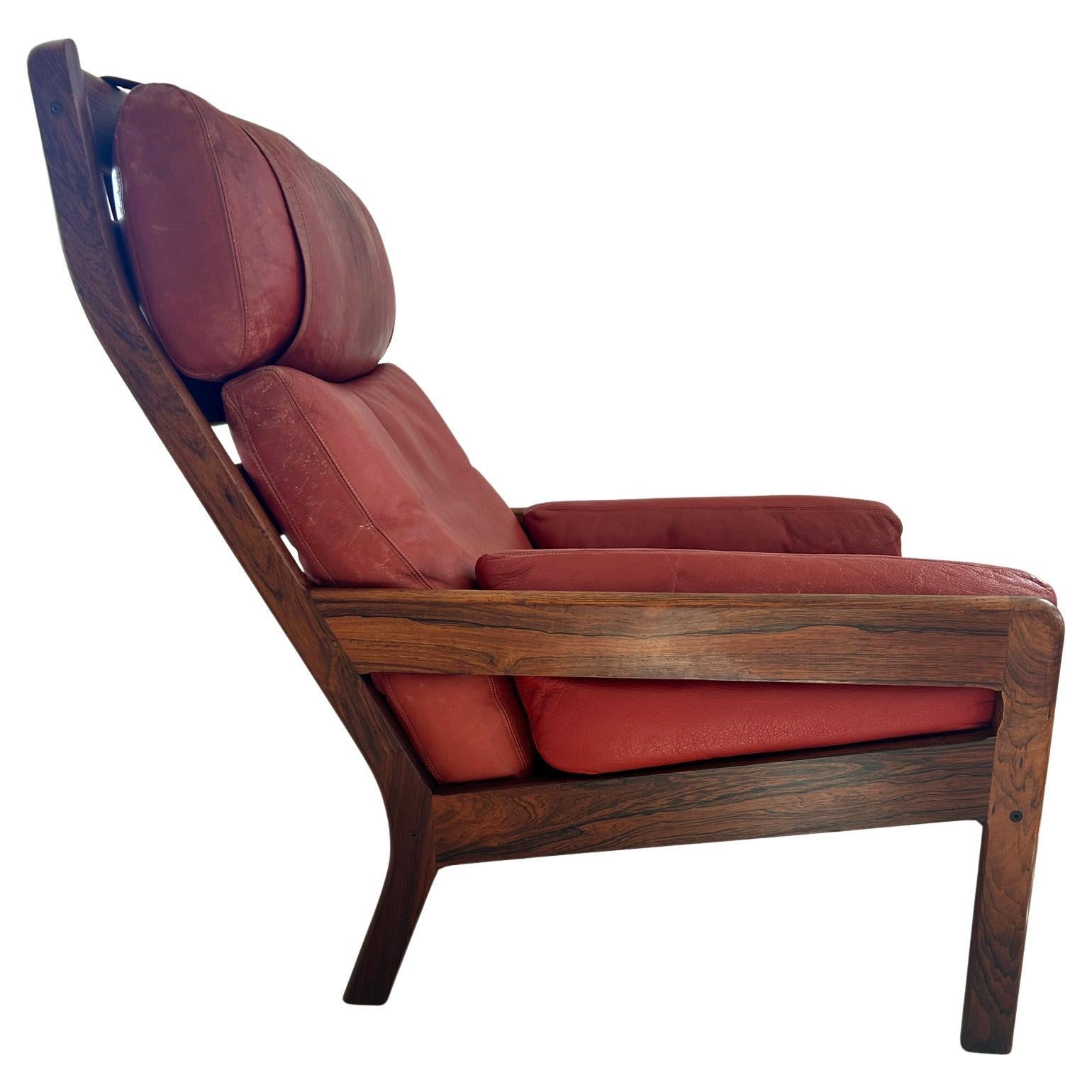 Fabulous Scandinavian Modern low lounge chair attributed to Illum Wikkelsø / Arne Norell c. 1960 Solid Rosewood frame and red leather cushions. Made in Denmark. Located in Brooklyn NYC

Dimensions: H 37