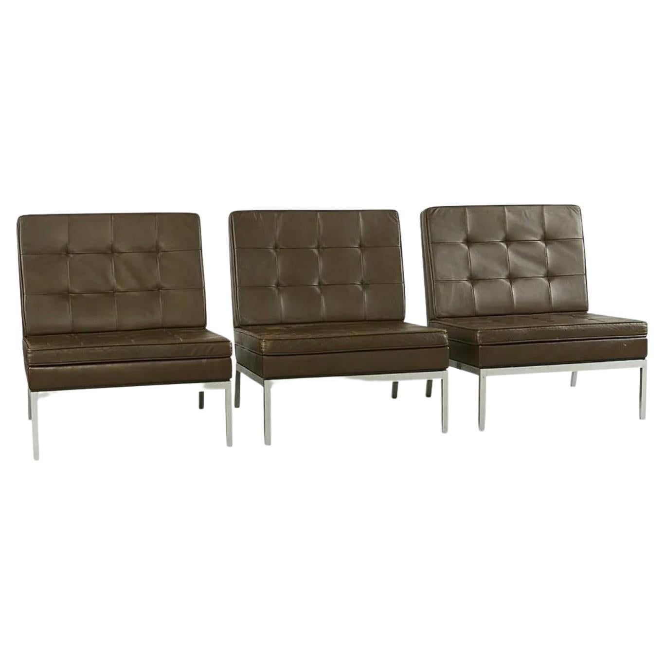 Vintage Mid Century original mid century Model 65 chairs by Florence Knoll for Knoll International. Classic great lines. The chrome bases are good shape with all original Knoll Brown Leather upholstery that is in great Vintage condition. Original