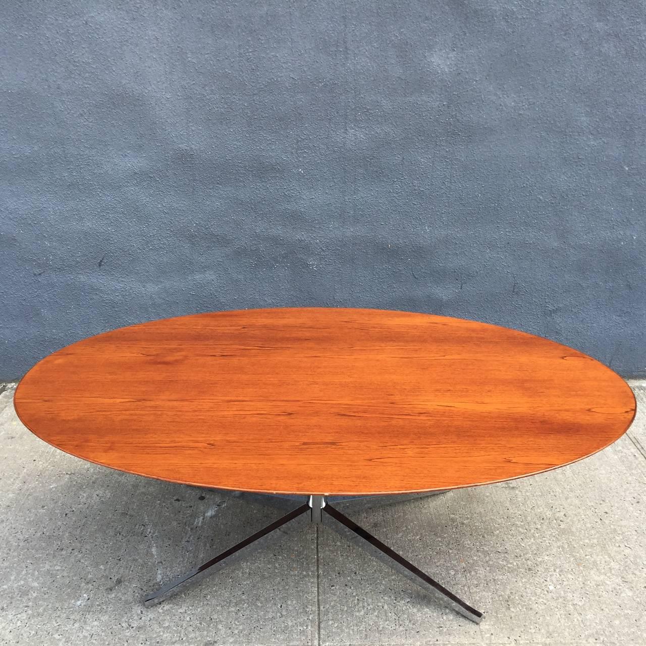For your consideration is a hard-to-find Florence Knoll oval table/desk in Brazilian Rosewood.

Florence Knoll designed this iconic desk to free the executive suite from the clutter of the traditional drawers attached to the workstation. The desk
