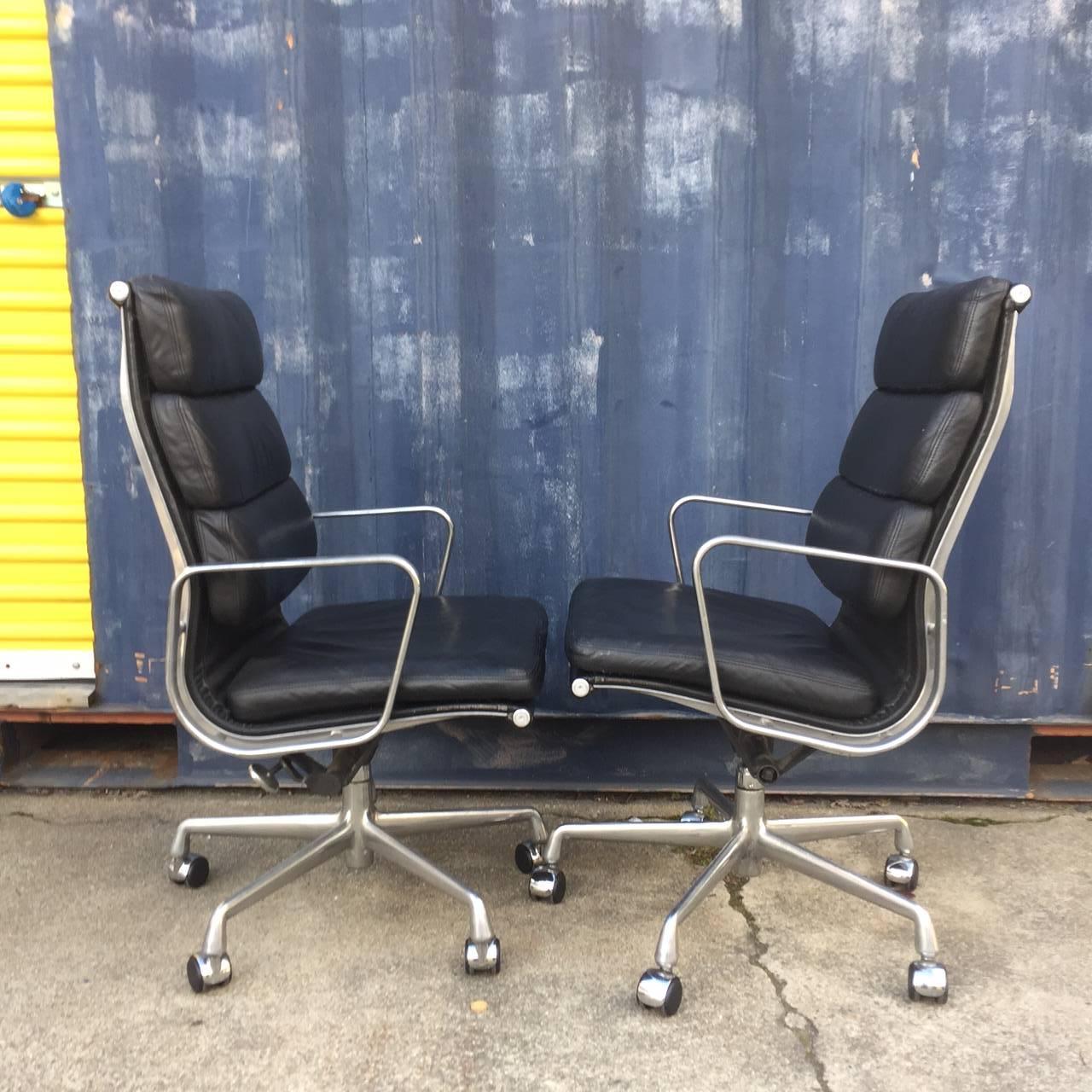 For your consideration are up to two Eames for Herman Miller soft pad chairs with high backs.

These chairs are icons of Mid-Century Modern design, and continue to be produced by Herman Miller to this day.

The black leather is soft and supple.
