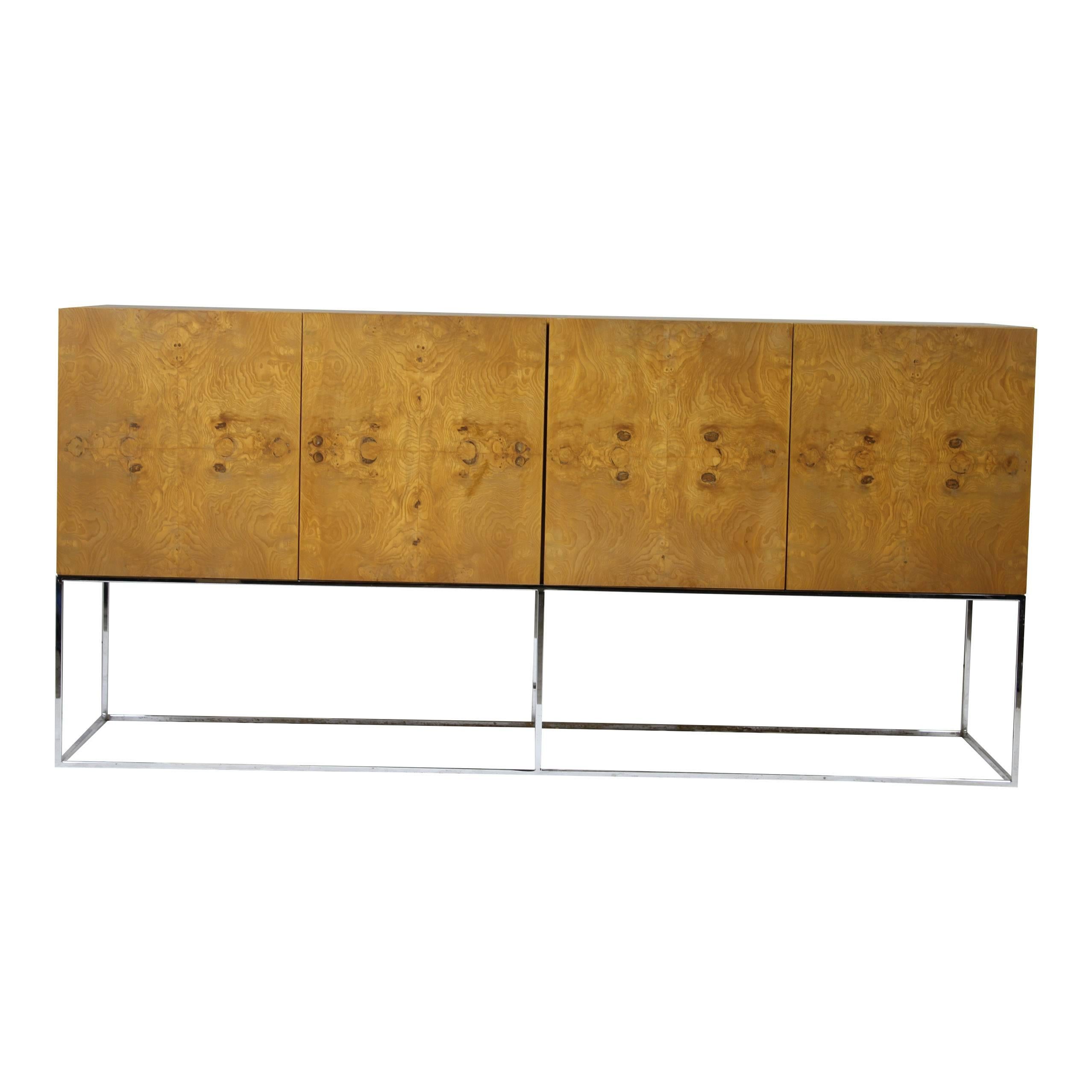 For sale I have a beautiful Milo Baughman for Thayer Coggin sideboard or credenza in bookmatched Olive burl wood veneer on a slim chrome base.

The piece is a beautiful Mid-Century Modern / 1970s statement piece from one of the masters of American