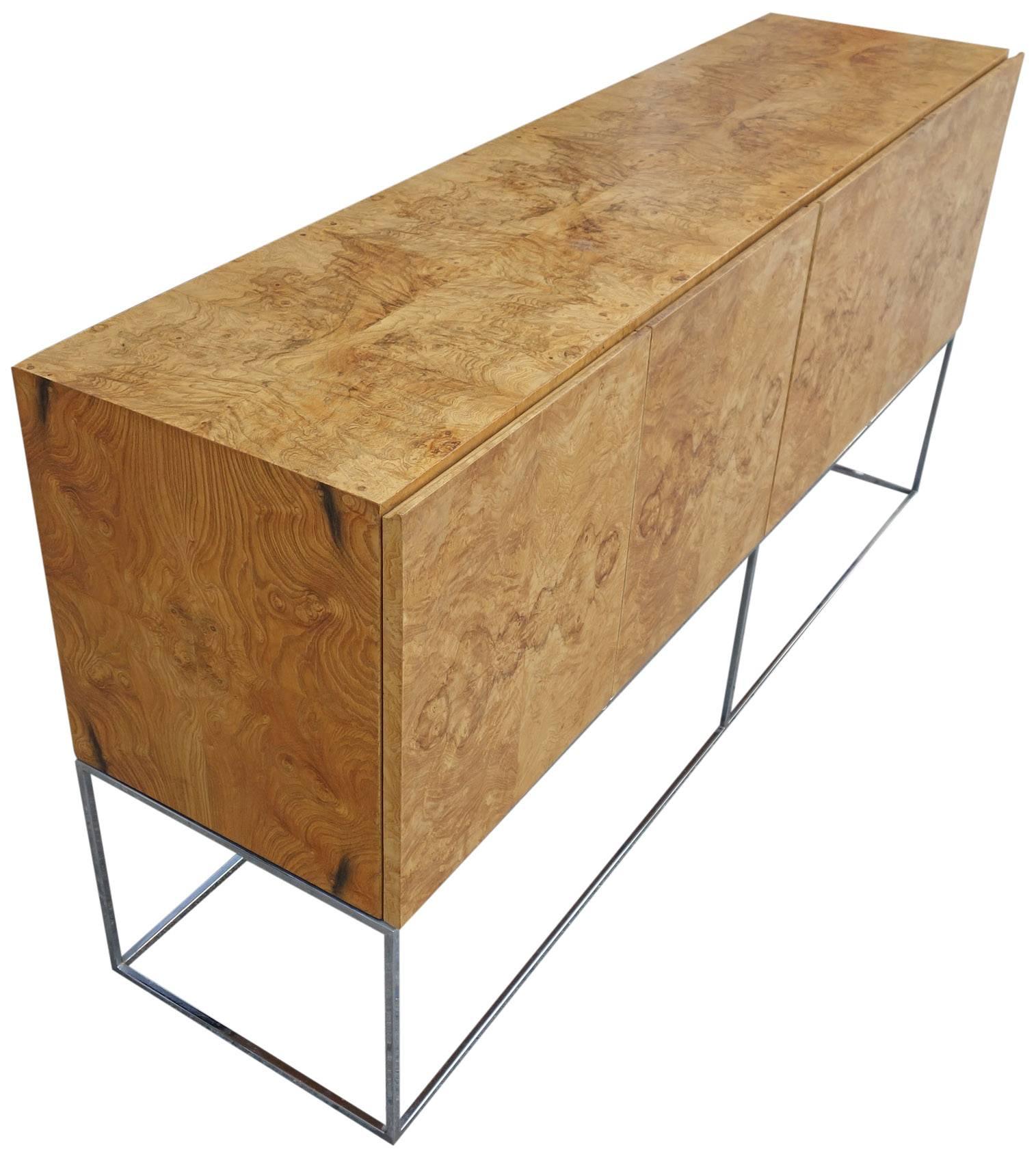 For your consideration is a beautiful Milo Baughman for Thayer Coggin sideboard or credenza in bookmatched burl wood veneer on a slim chrome base. The piece is a beautiful Mid-Century Modern 1970s statement piece from one of the masters of American