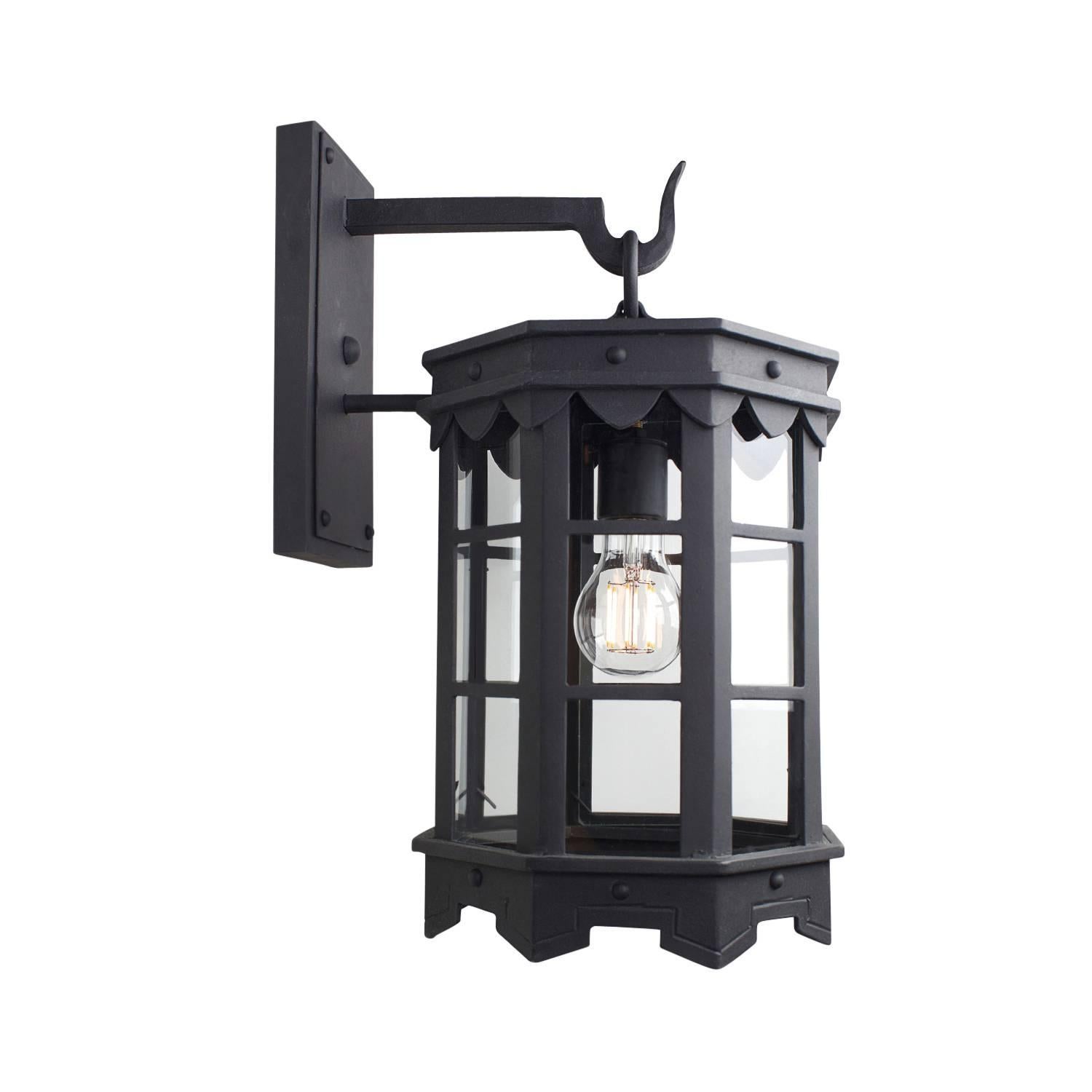 Our De La Guerra 08 lantern finished in our DLG Old World finish has Mediterranean style precedence with historic profiles and contemporized geometric lines. A striking fixture during the day but even more so at night when the patterned hem casts