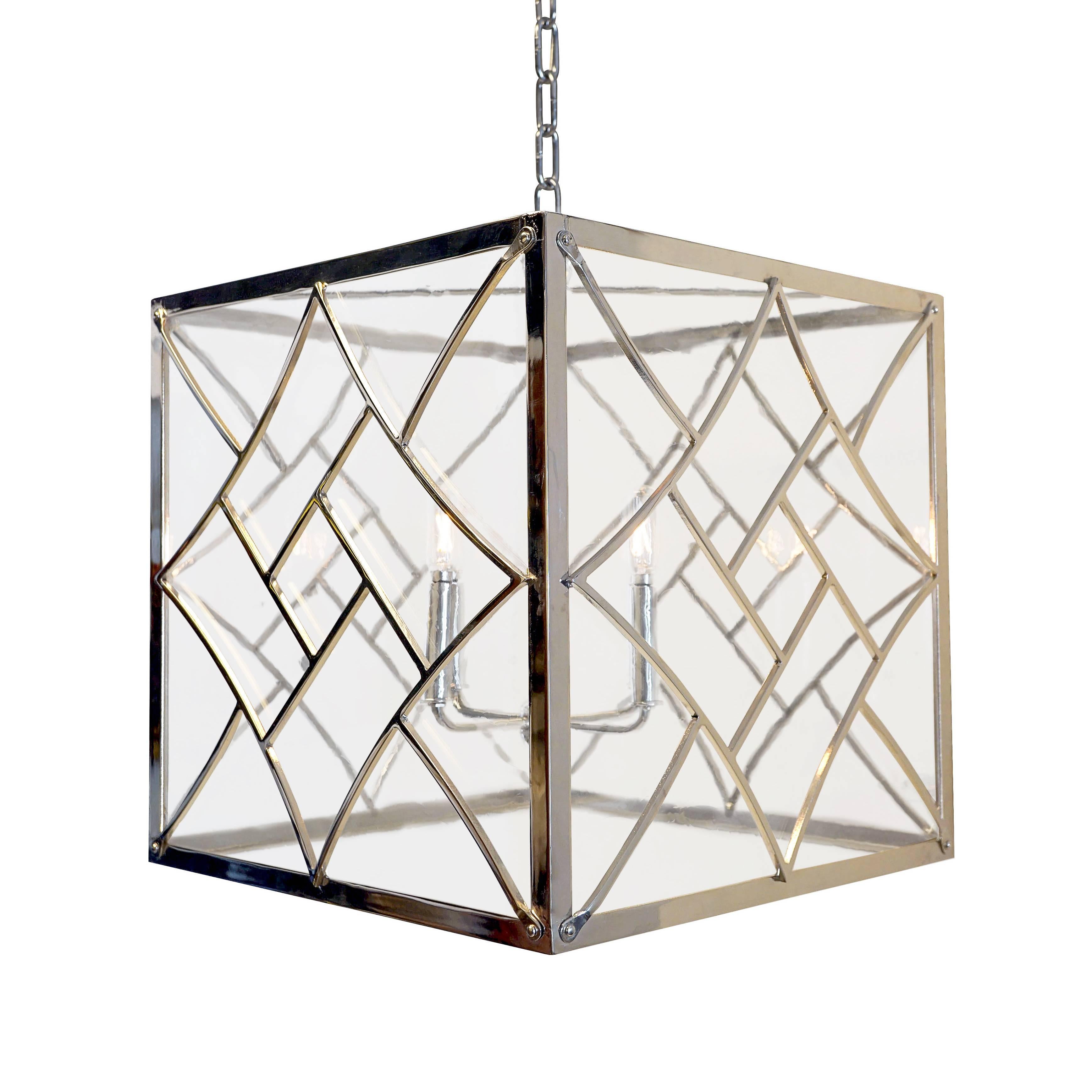 Evoking the Art Deco style of the 1920s and 1930s, our Nouveau cube pendant features bold geometric shapes and a chevron motif. 

Handcrafted in wrought iron. 

3' chain and canopy included in matching finish.
Max wattage: 60, four candelabra