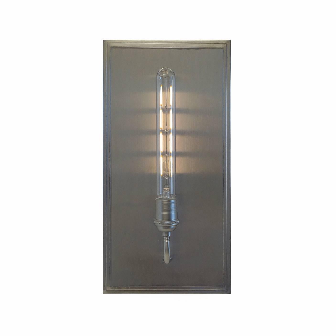 Forthright in its Art Deco inspired step design with clean lines and contemporary styling, this is an elegant interior sconce that is sure to be revered as a piece of art in any room.

Fixture shown in SBLC Brushed Nickel finish.

Hand-forged in