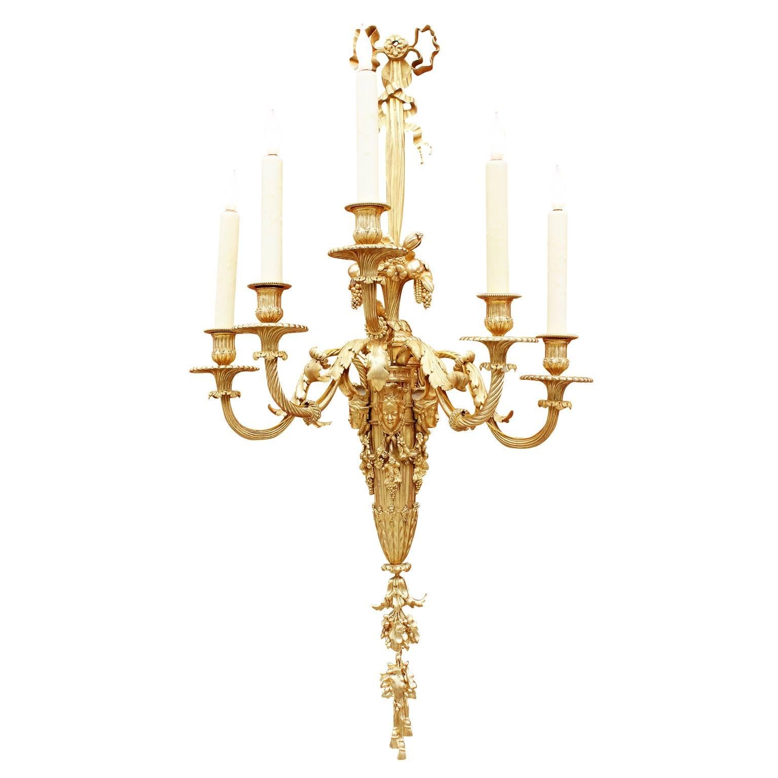 A very fine pair of French 19th century Louis XVI style gilt bronze five-light figural wall lights (Sconces - Appliques) after the model by Pierre-Philippe Thomire (French, 1751–1843) and also after a model by François Rémond (French, 1747-1812).