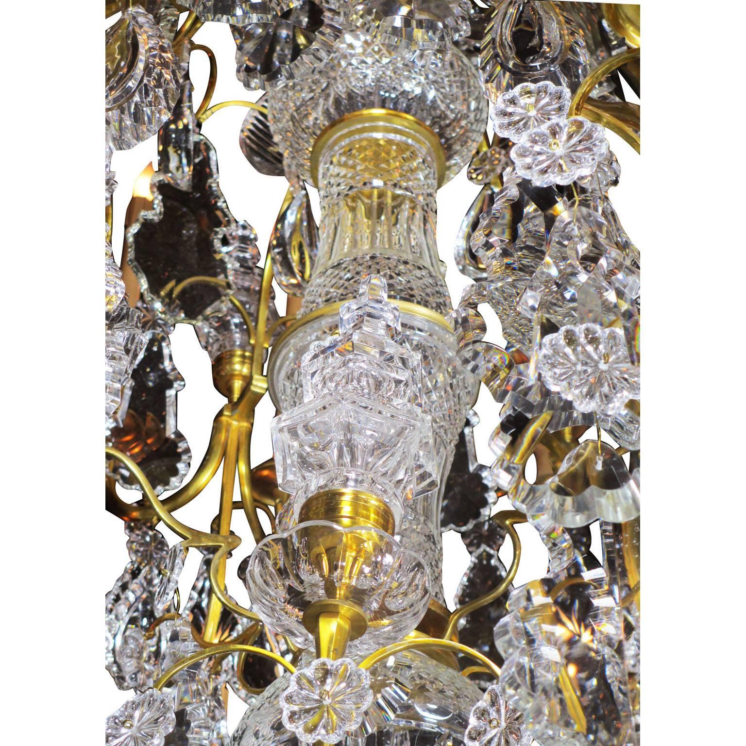 A Louis XV Style Gilt-Bronze and Cut-Glass Twenty-four-light Chandelier  In Good Condition For Sale In Los Angeles, CA