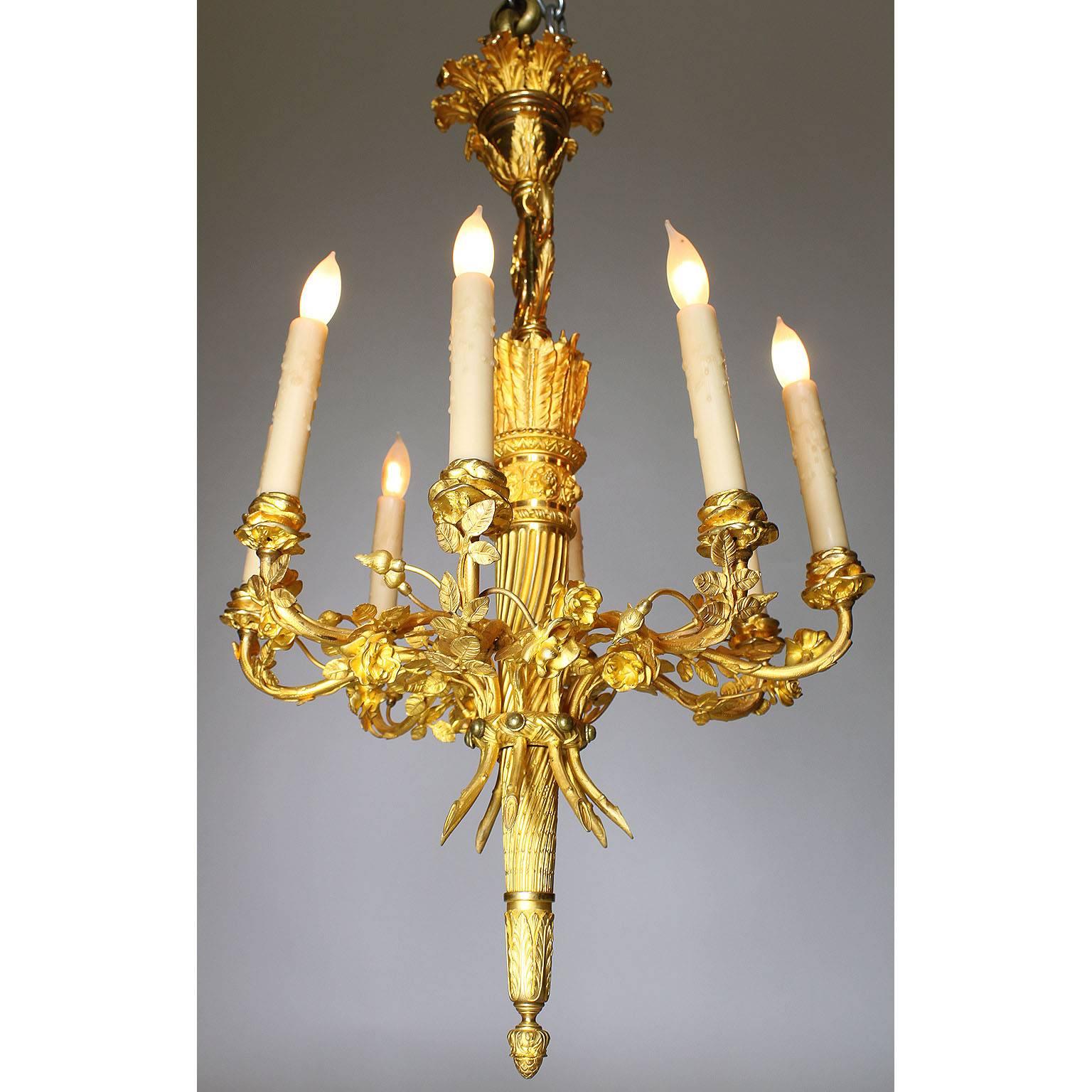 A very fine 19th century Louis XVI style gilt bronze eight-light chandelier with superb quality chasing and gilt, the arms surmounted with floral decorations in the form of a bouquet. In the style of Pierre Gouthière (French, 1732-1813), Paris,