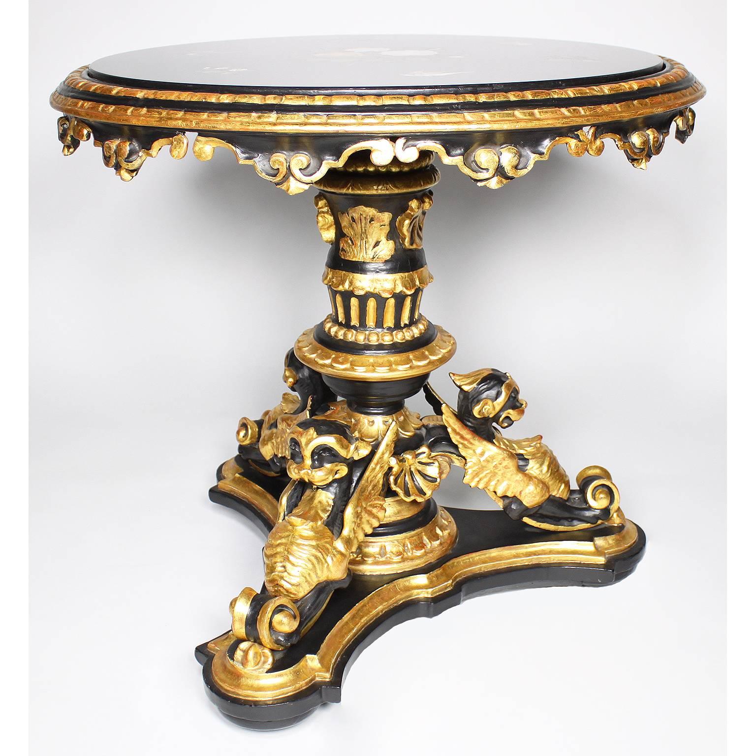 A fine Italian 19th-20th century Baroque Revival style ebonized and parcel Giltwood carved figural round side table with a pietra-dura top with Lapiz and other colorful inlaid stones depicting floral arrangements and flying birds. The base with