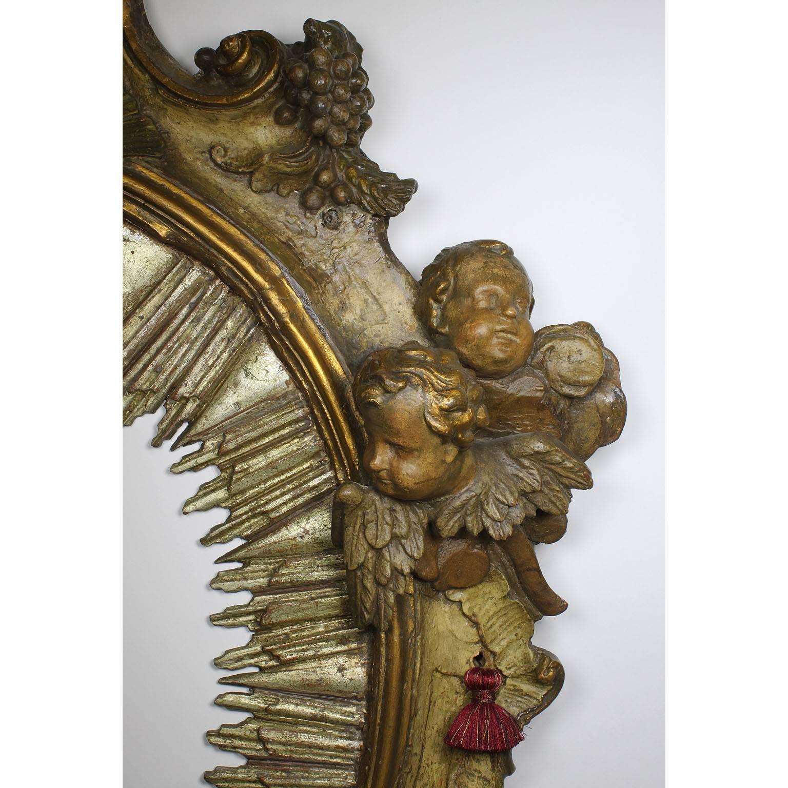 Giltwood  Italian Baroque 18th Century Parcel-Gilt Silver Carved Wood Mirror with Cherubs