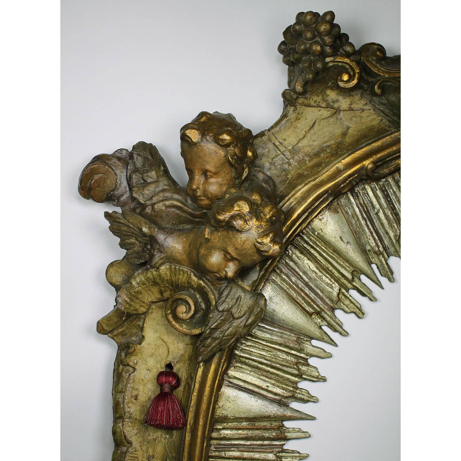  Italian Baroque 18th Century Parcel-Gilt Silver Carved Wood Mirror with Cherubs In Good Condition In Los Angeles, CA