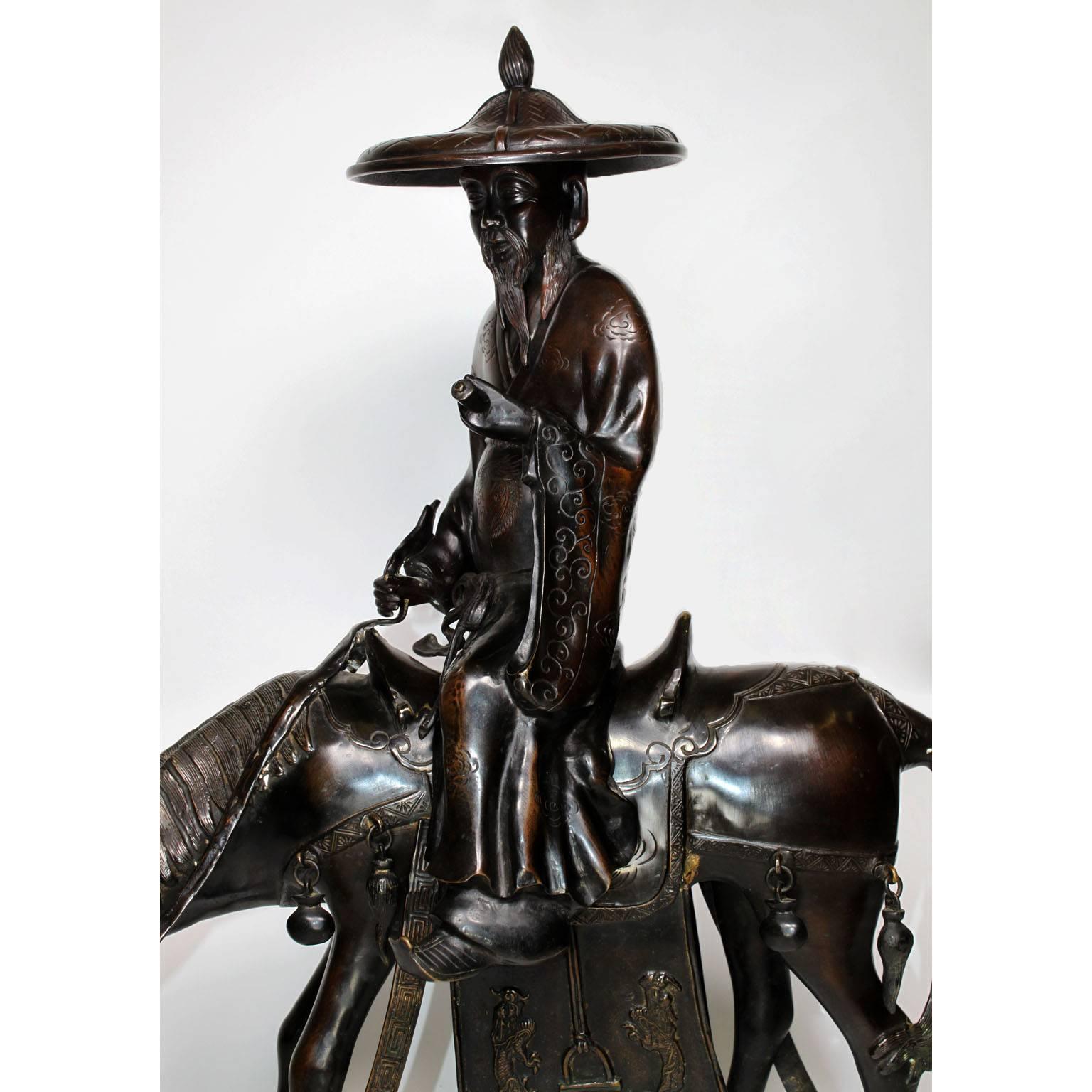 A fine and large Japanese Meiji period 19th-20th century bronze figural incense burner censer depicting an old man riding a donkey - mule. Signed in Japanese. In a brown patina, circa 1900.

The burning of incense in Japan began during the 6th