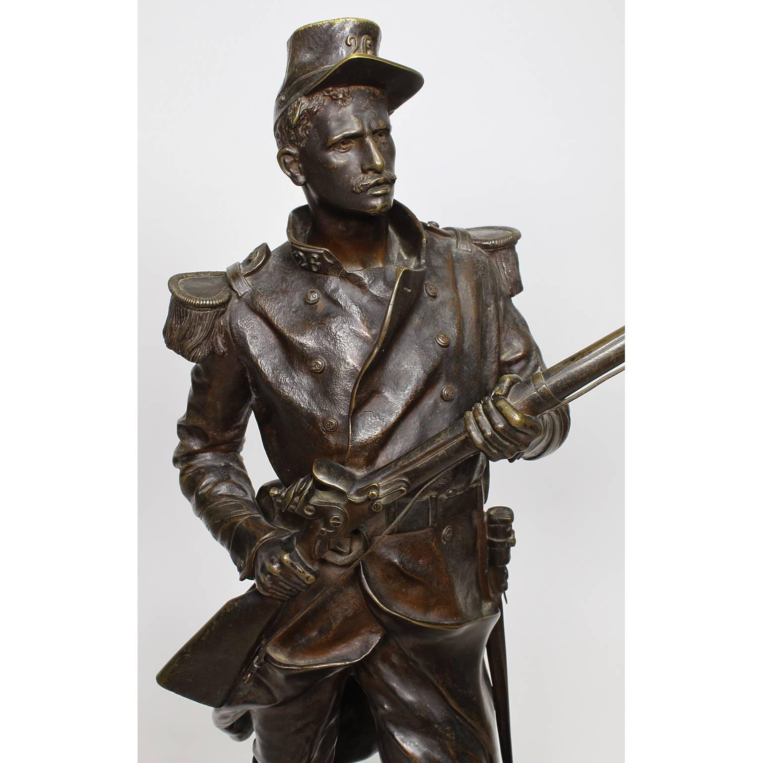 A very fine French 19th century patinated bronze figure of the French hero of the Algerian conquest, Jean-Pierre Hippolyte Blandan (1819-1842) after the French Sculptor Jean Gautherin (1840-1890). The standing soldier in full military garb holding