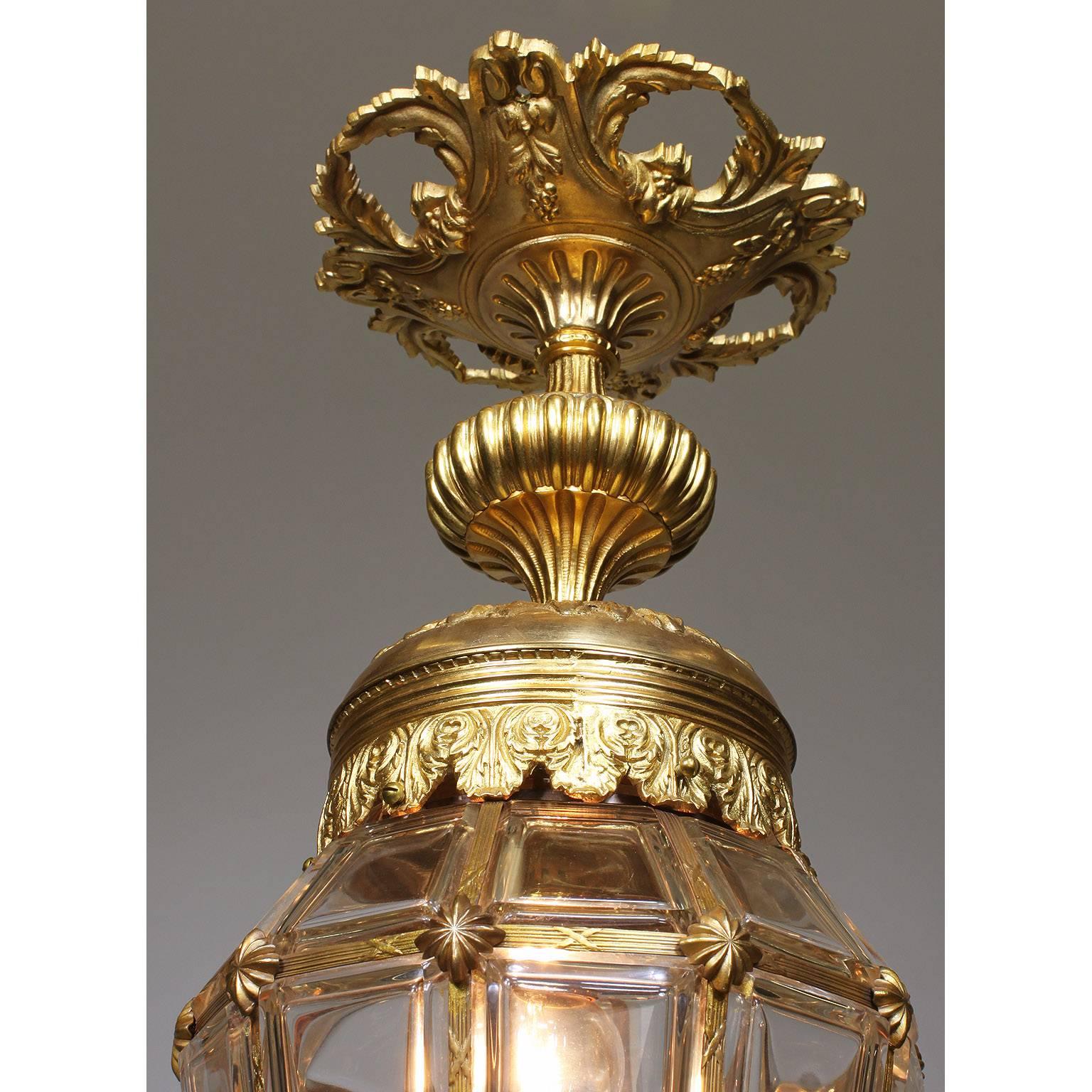 A fine and charming French Louis XIV style early 20th century gilt bronze and molded glass 