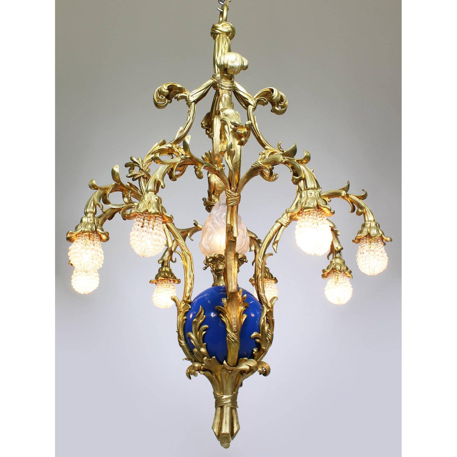 A very fine and rare French Belle Époque 19th-20th century nine-light gilt and enameled bronze 