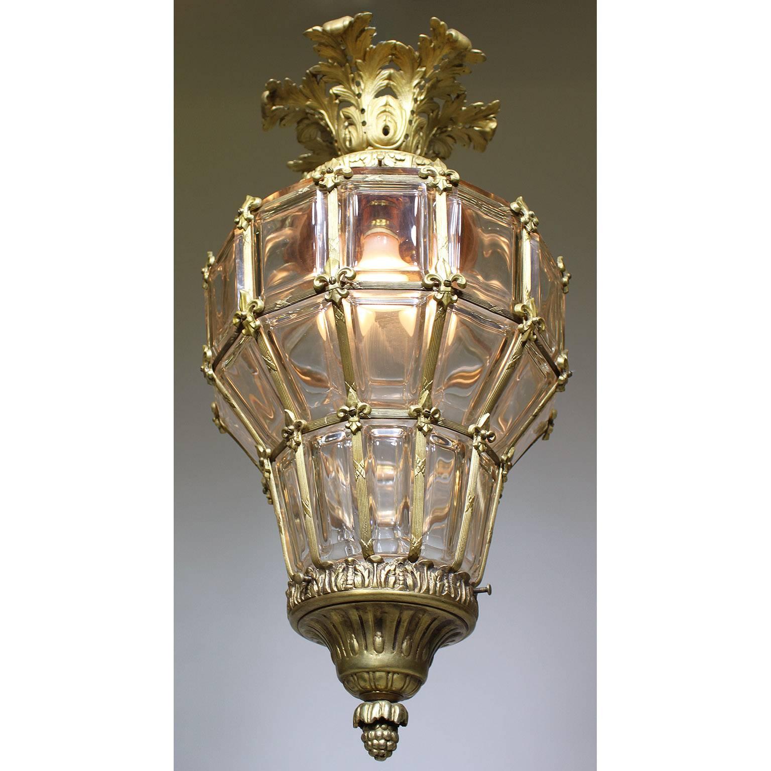A charming French, early 20th century, Louis XIV style gilt bronze and gilt metal molded glass 