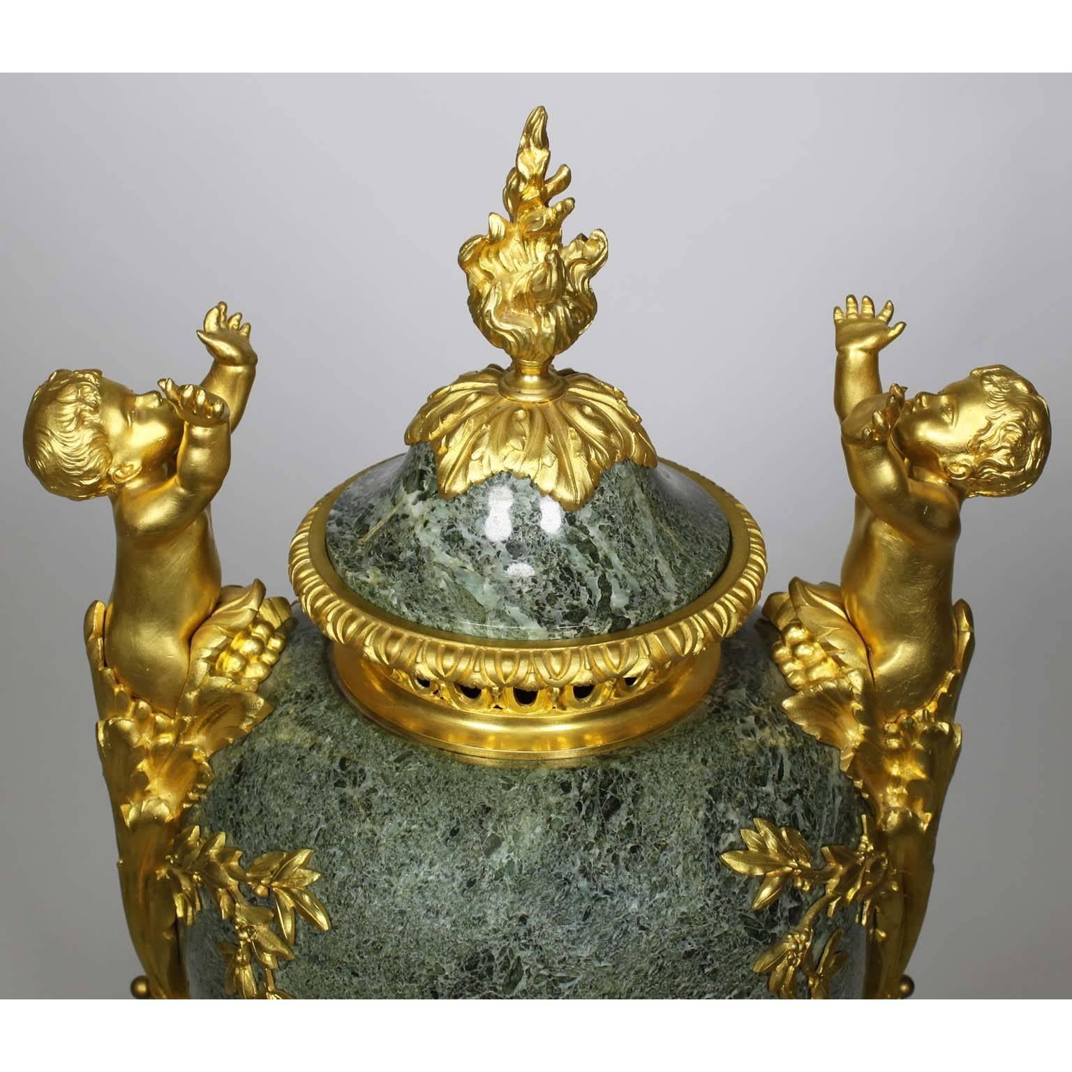Early 20th Century French 19th-20th Century Louis XVI Style Gilt-Bronze & Marble Urn with Children For Sale