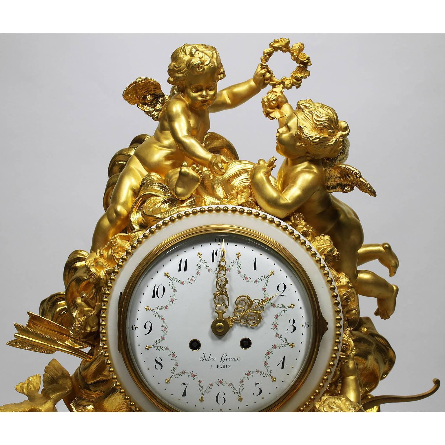 An important and palatial French Louis XV style 19th century gilt bronze and white marble mantel clock attributed to Alfred-Emmanuel-Louis Beurdeley, the casting and gilding by Jules Graux, Paris, The Movement by Japy Freres & Cie. The large and
