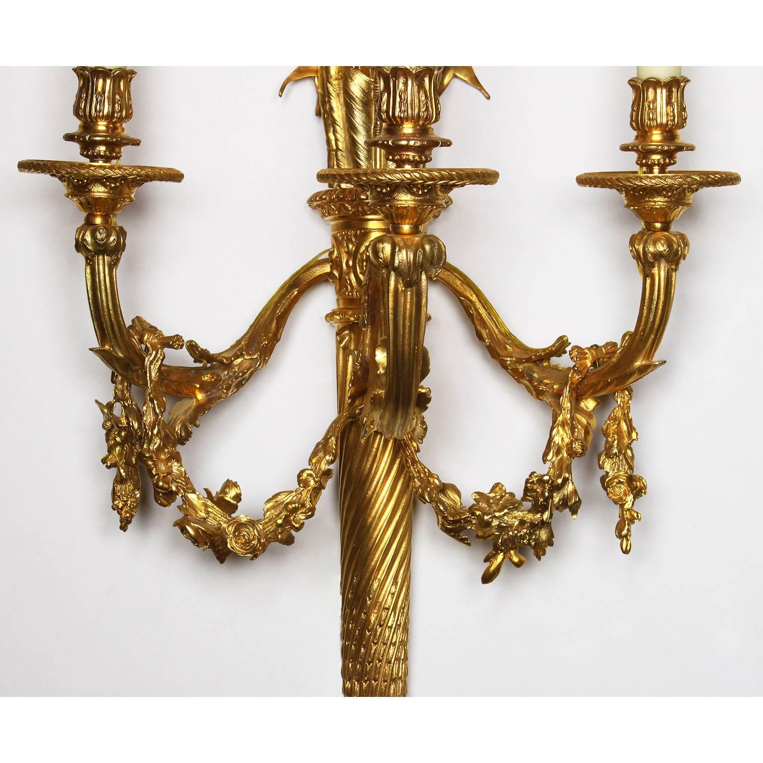 Pair of French 19th-20th Century Louis XVI Style Gilt-Bronze Torch Wall Sconces In Good Condition For Sale In Los Angeles, CA