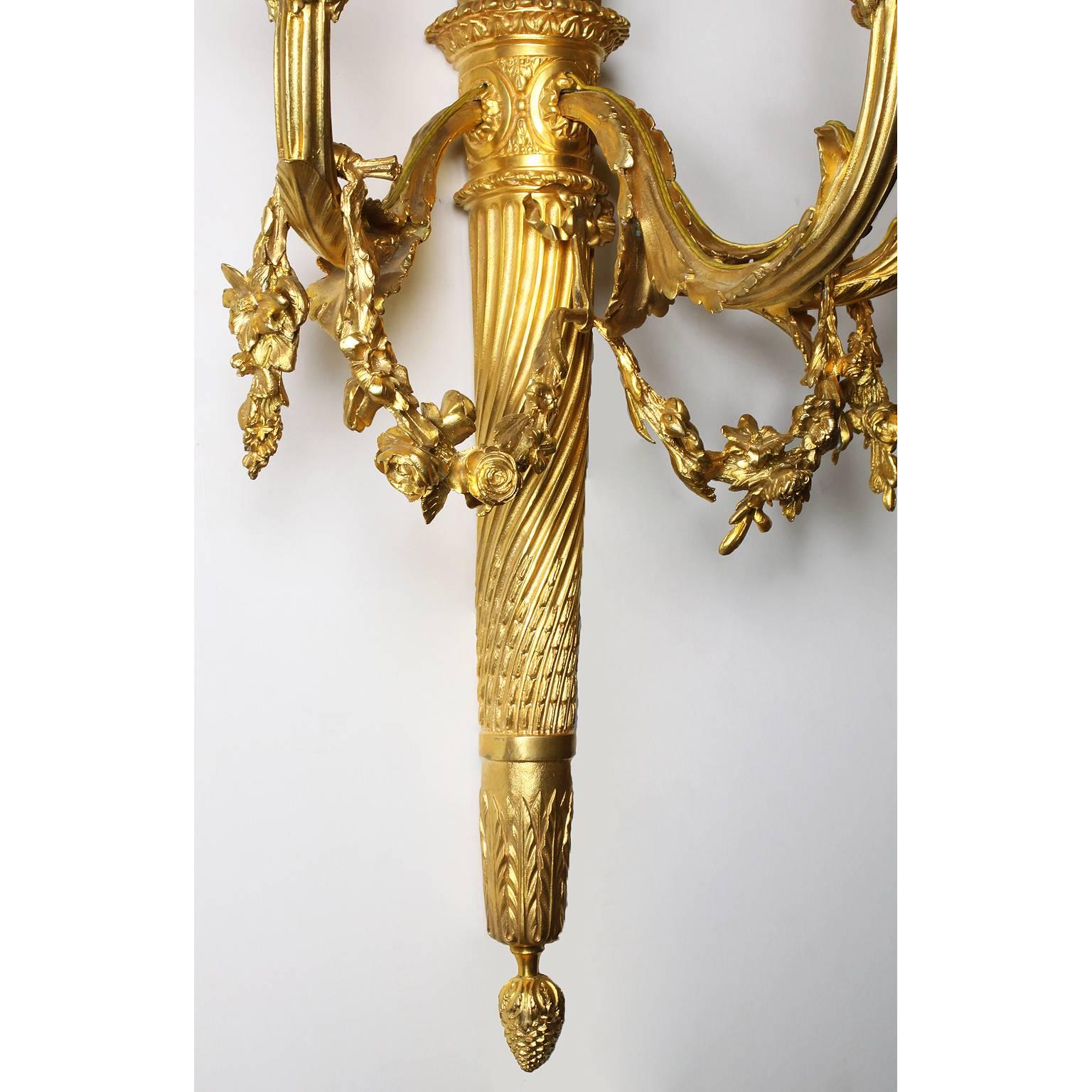 Early 20th Century Pair of French 19th-20th Century Louis XVI Style Gilt-Bronze Torch Wall Sconces For Sale