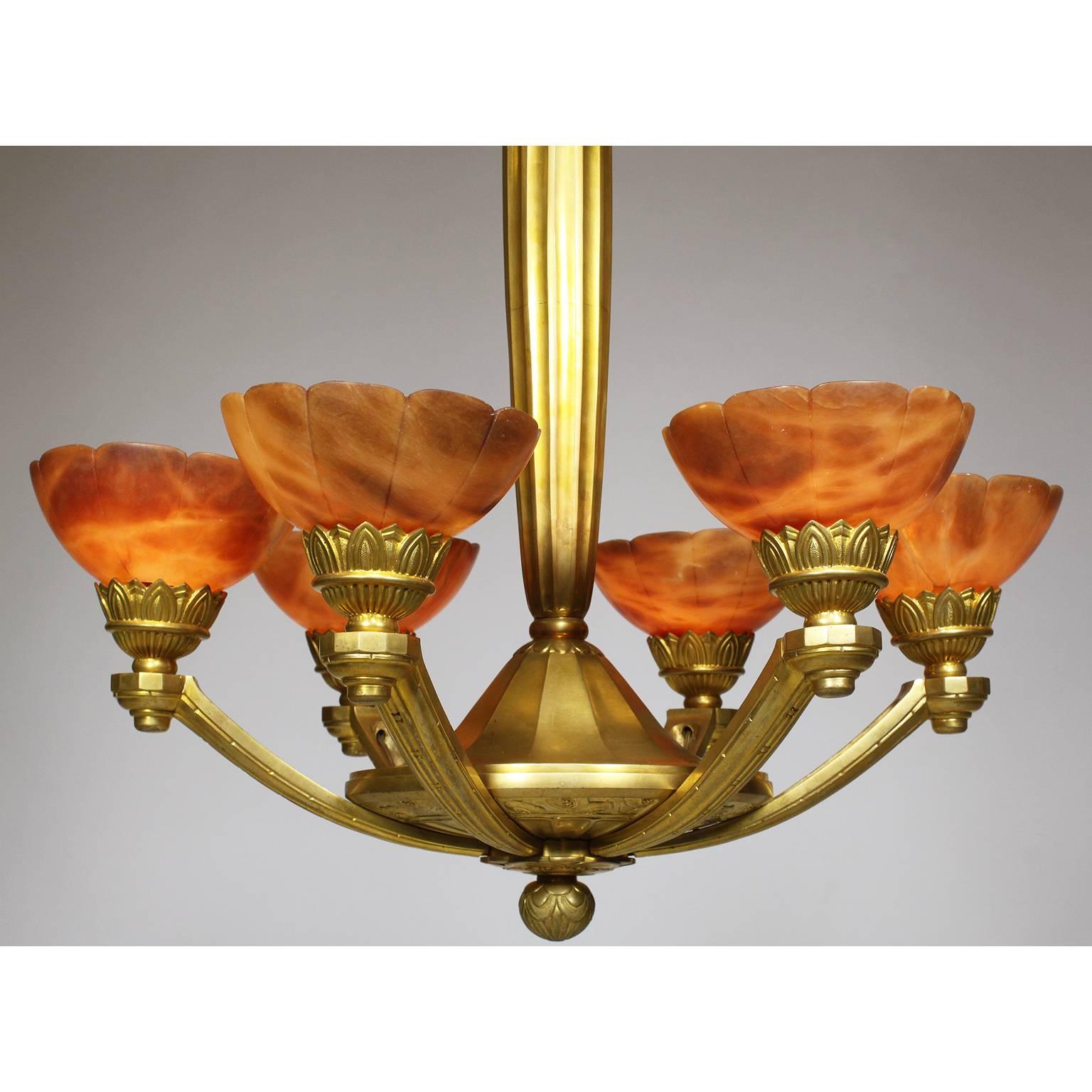 A fine and rare French Art-Deco gilt bronze and amber alabaster six-light chandelier, Paris, circa 1920.

Measures: Height: 37 1/4 inches (94.6 cm)
Width: 24 inches (60.1 cm)

Ref.: A1803 - Lot 10718.