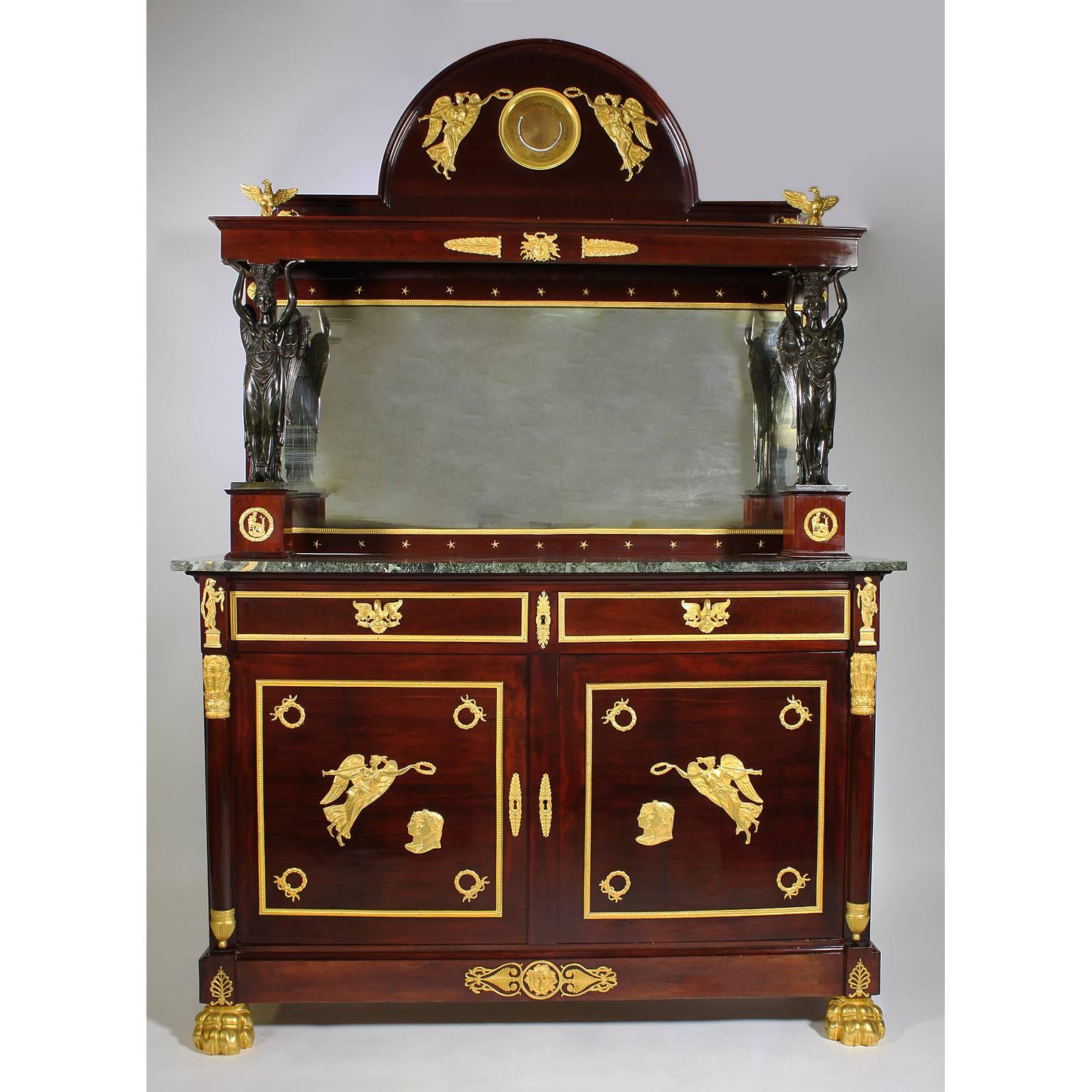 An impressive pair of Napoleon III Empire Revival mahogany, gilt-bronze and patinated bronze-mounted server buffets, after Pierre-Philippe Thomire (1751-1843), each cabinet surmounted with a pair of winged maidens on mahogany stands mounted with