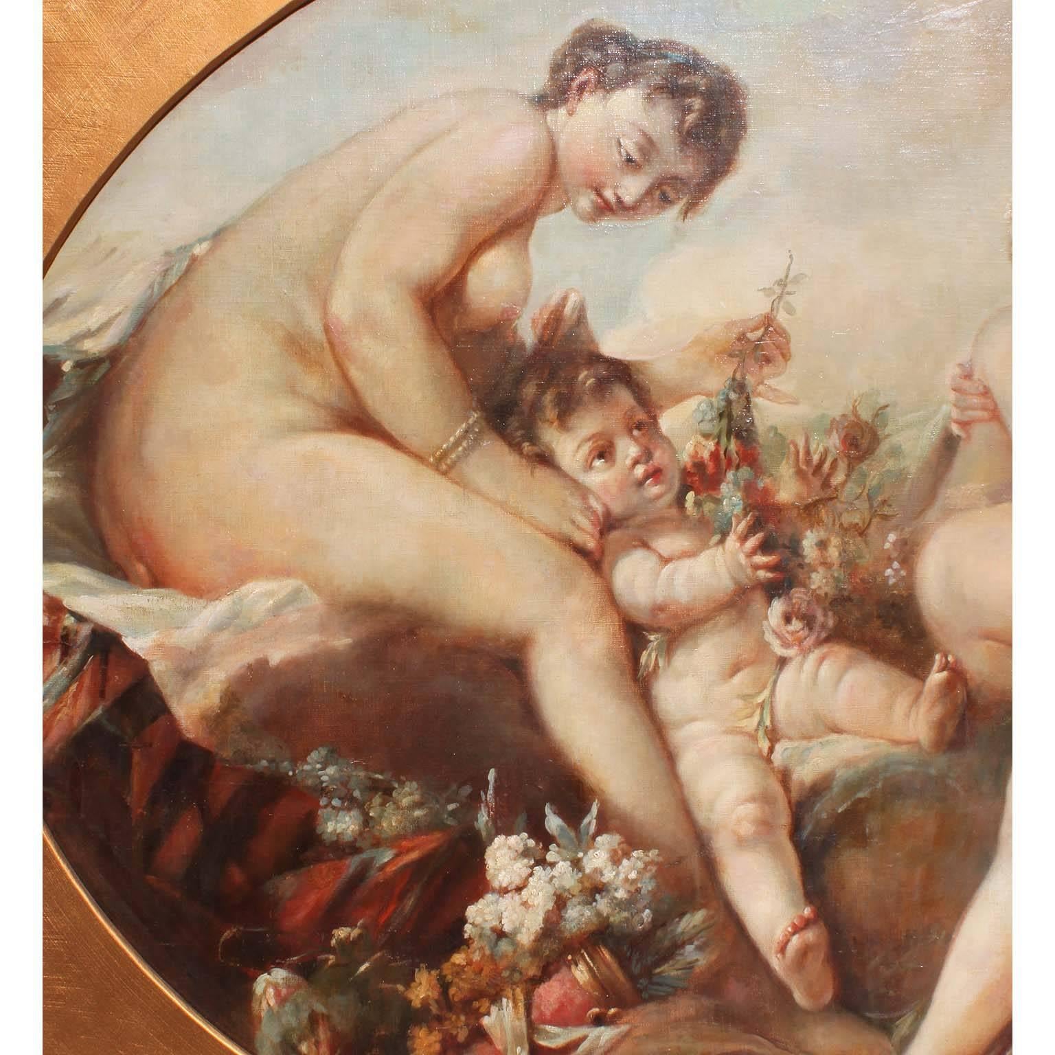 A large French 19th century oil on canvas laid on board painting in the manner of François Boucher (French, 1703-1770). The oval framed canvas depicting a version of Boucher's 