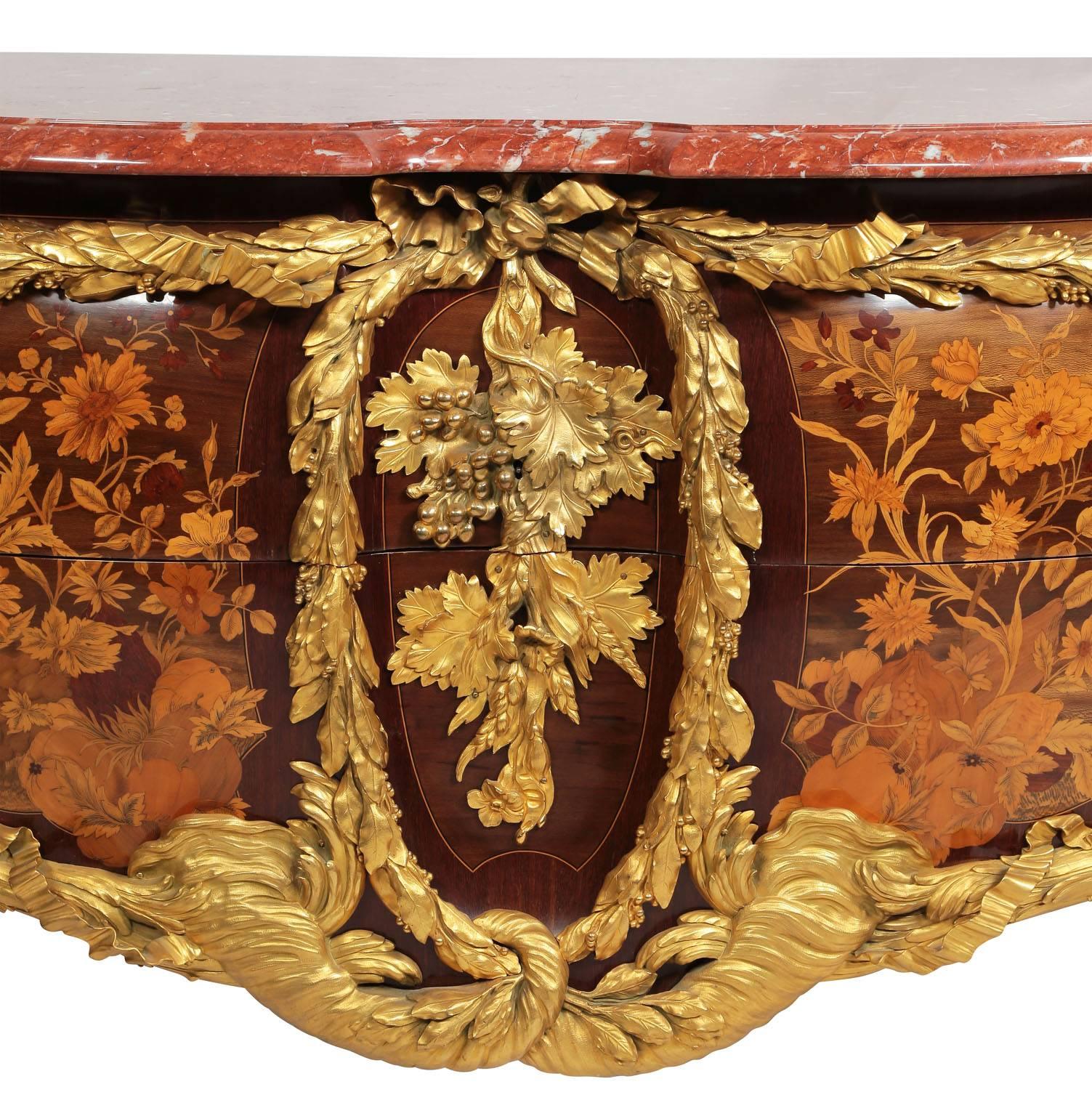A French Louis XV style ormolu-mounted and end-cut floral and fruit marquetry two-drawer serpentine-shaped bombé commode by François Linke (1855-1946), Index number 720, the mounts designed by Leon Messagé, Circa 1910-1915. The serpentine-shaped