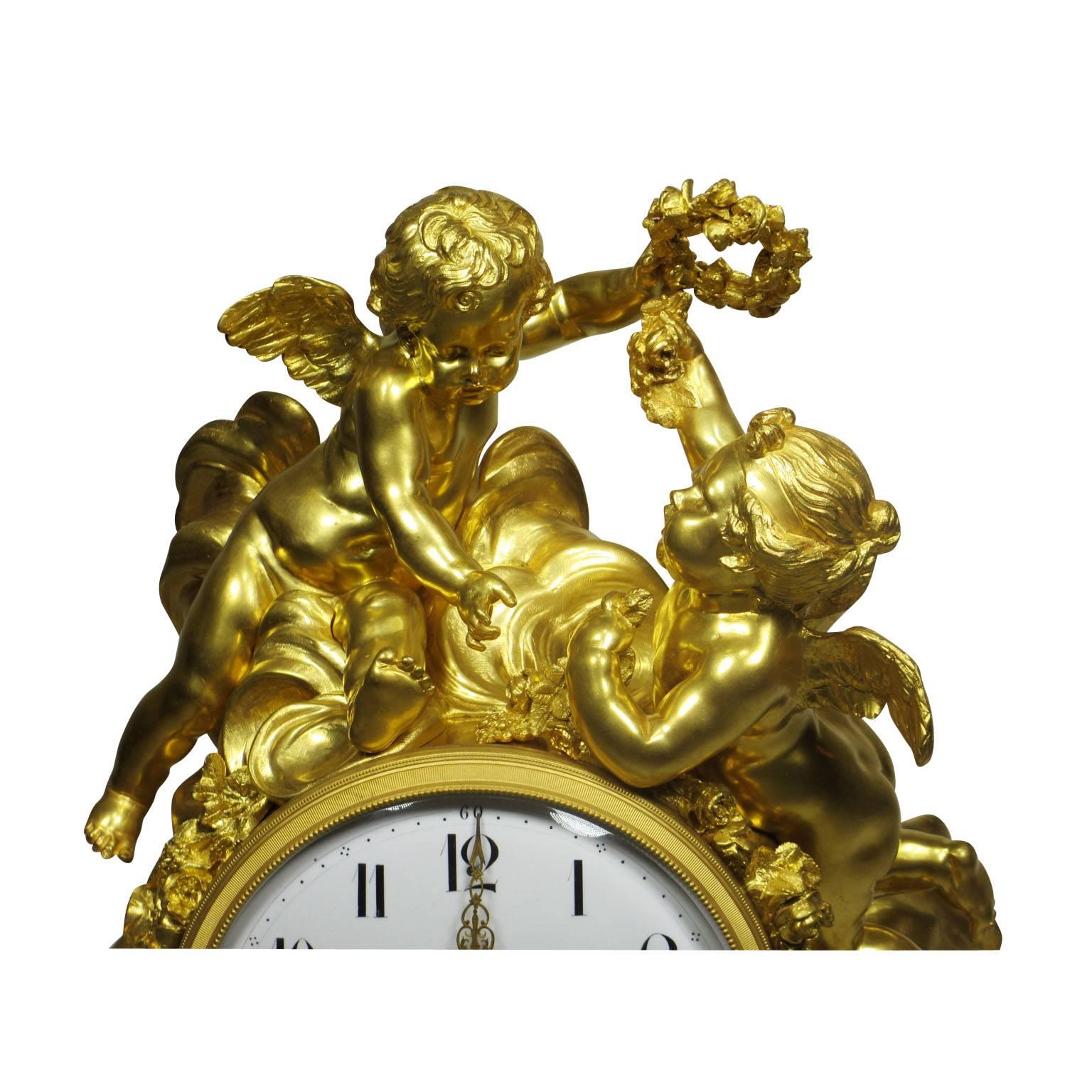 A very fine and important palatial Louis XV style 19th-20th century figural gilt bronze white marble mantel clock with figures of cherubs, the enamel dial with Arabic numerals and foliate pierced gilt hands. in the style of Alfred-Emmanuel-Louis