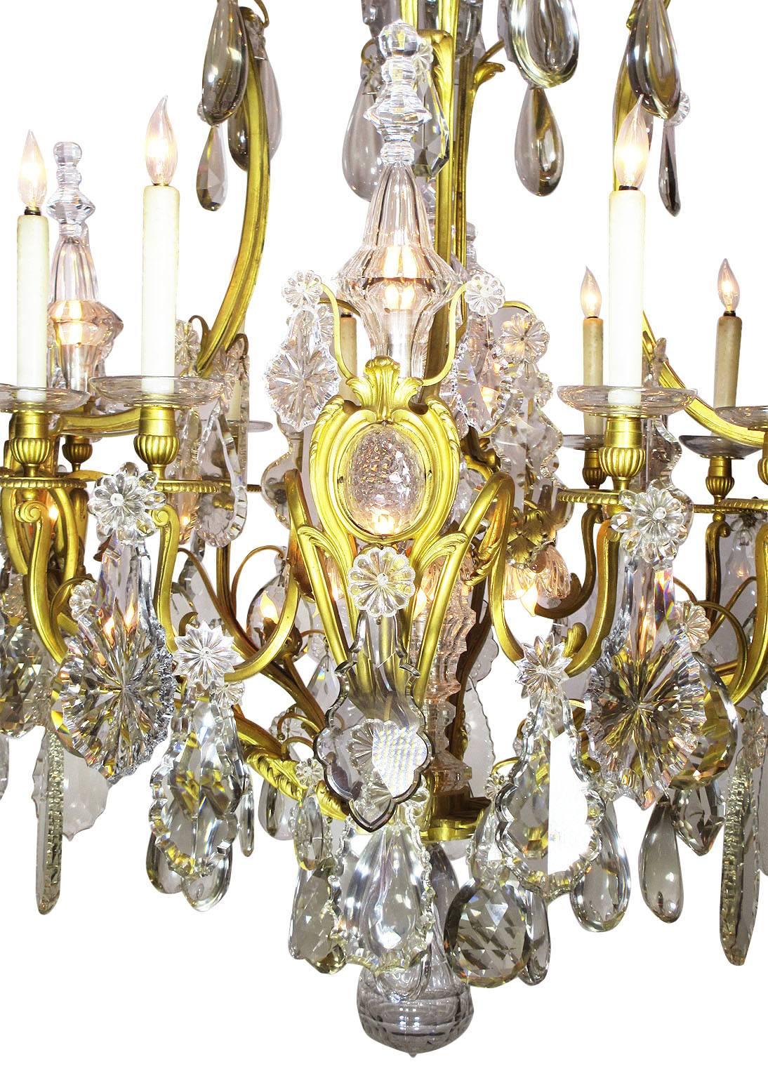 The Spelling Manor living-room chandelier. A very Fine and Palatial French 19th century Louis XV style gilt bronze and Crystal Thirty-Three Light Twelve candelabra Chandelier attributed to Baccarat. The large finely chased gilt bronze frame