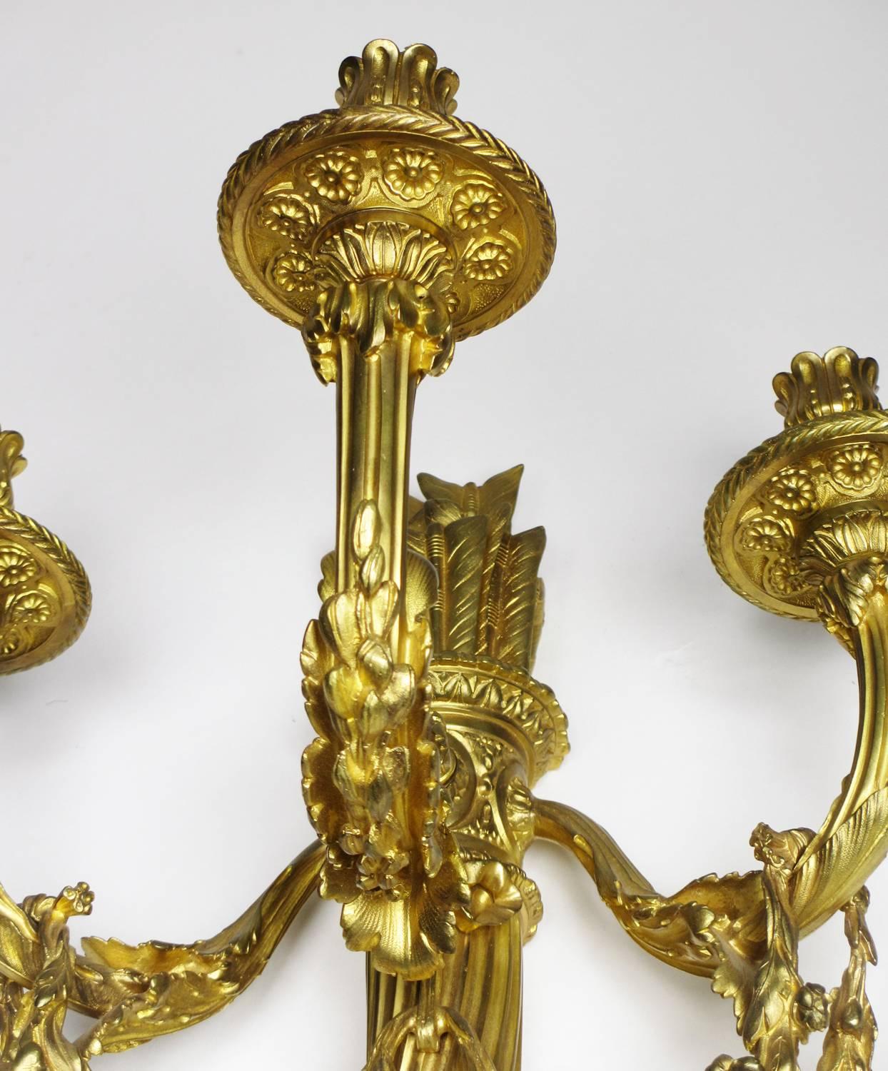 Gilt Pair of French 19th-20th Century Louis XVI Style Three-Light Wall Sconces