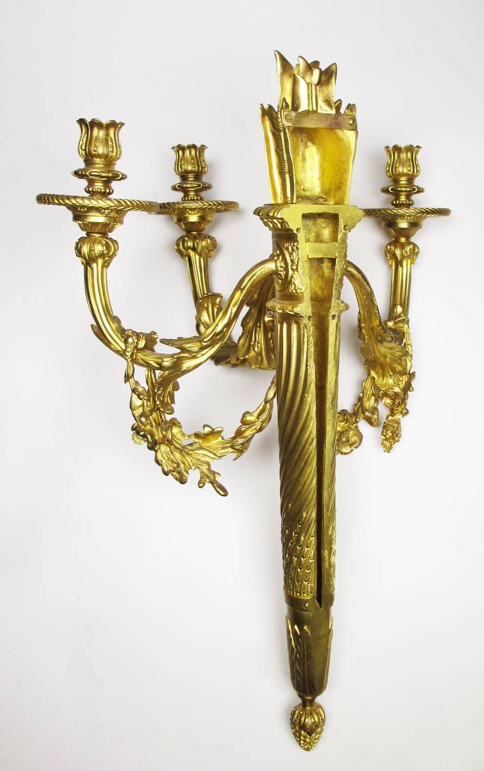 Early 20th Century Pair of French 19th-20th Century Louis XVI Style Three-Light Wall Sconces